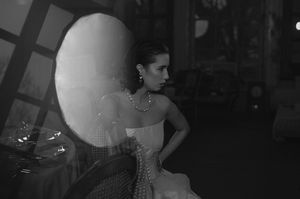 Dramatic black and white bridal portrait with artistic lighting.