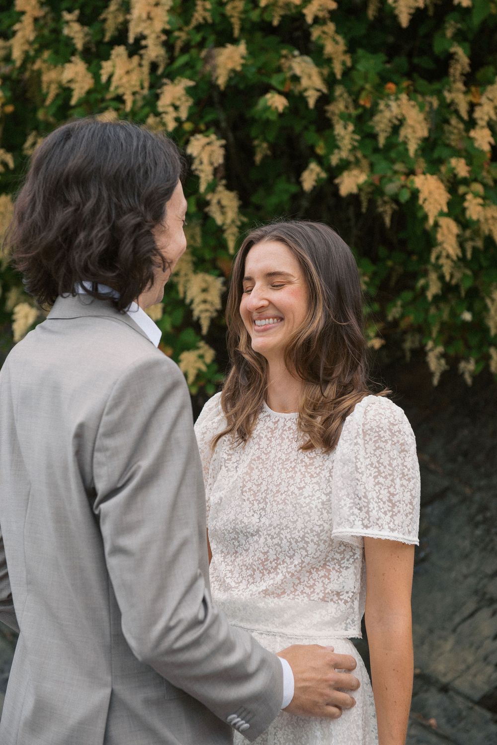 Romantic outdoor wedding portraits against autumn foliage background.