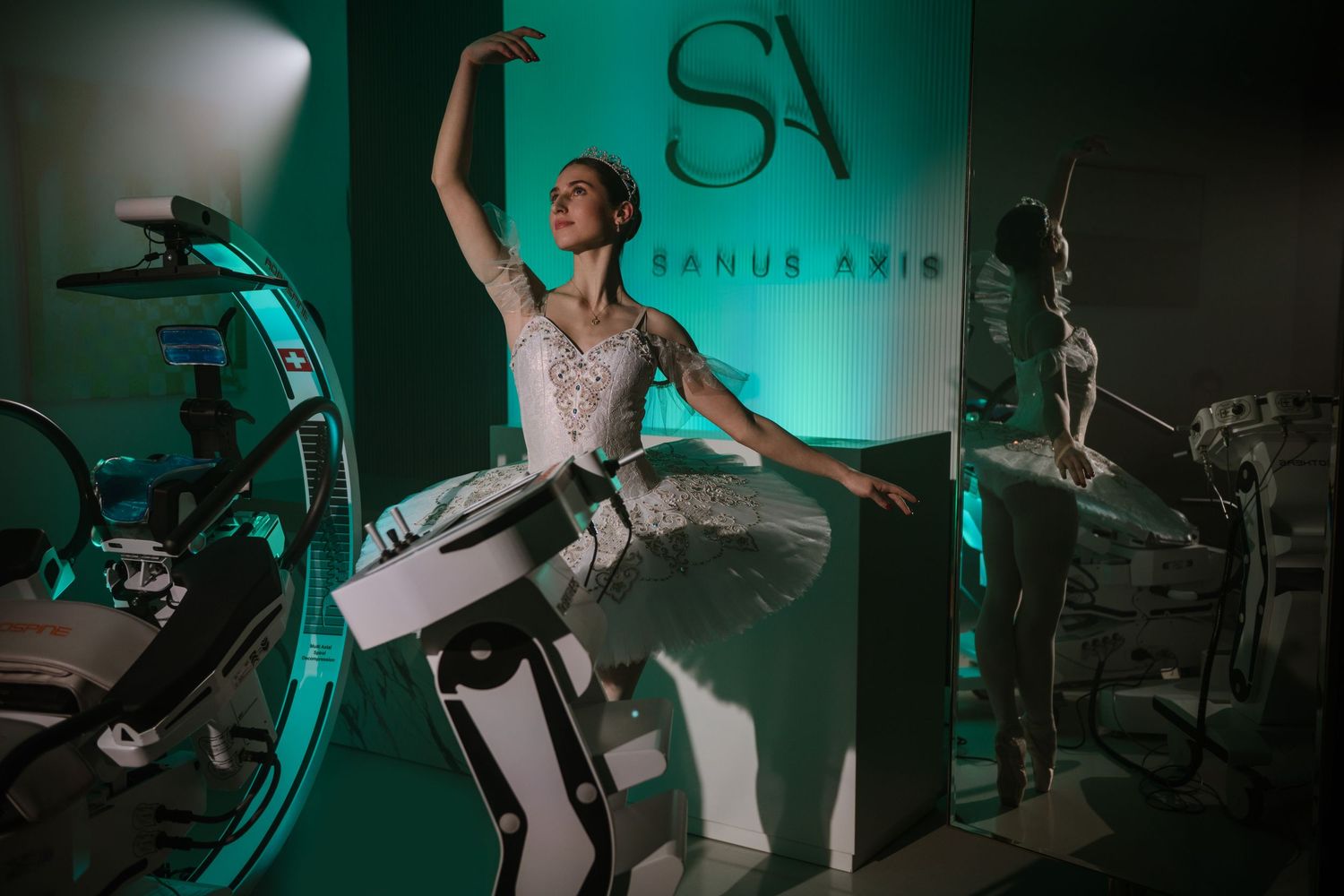 Concert performers on stage illuminated by dramatic turquoise lighting create an energetic atmosphere during live show.