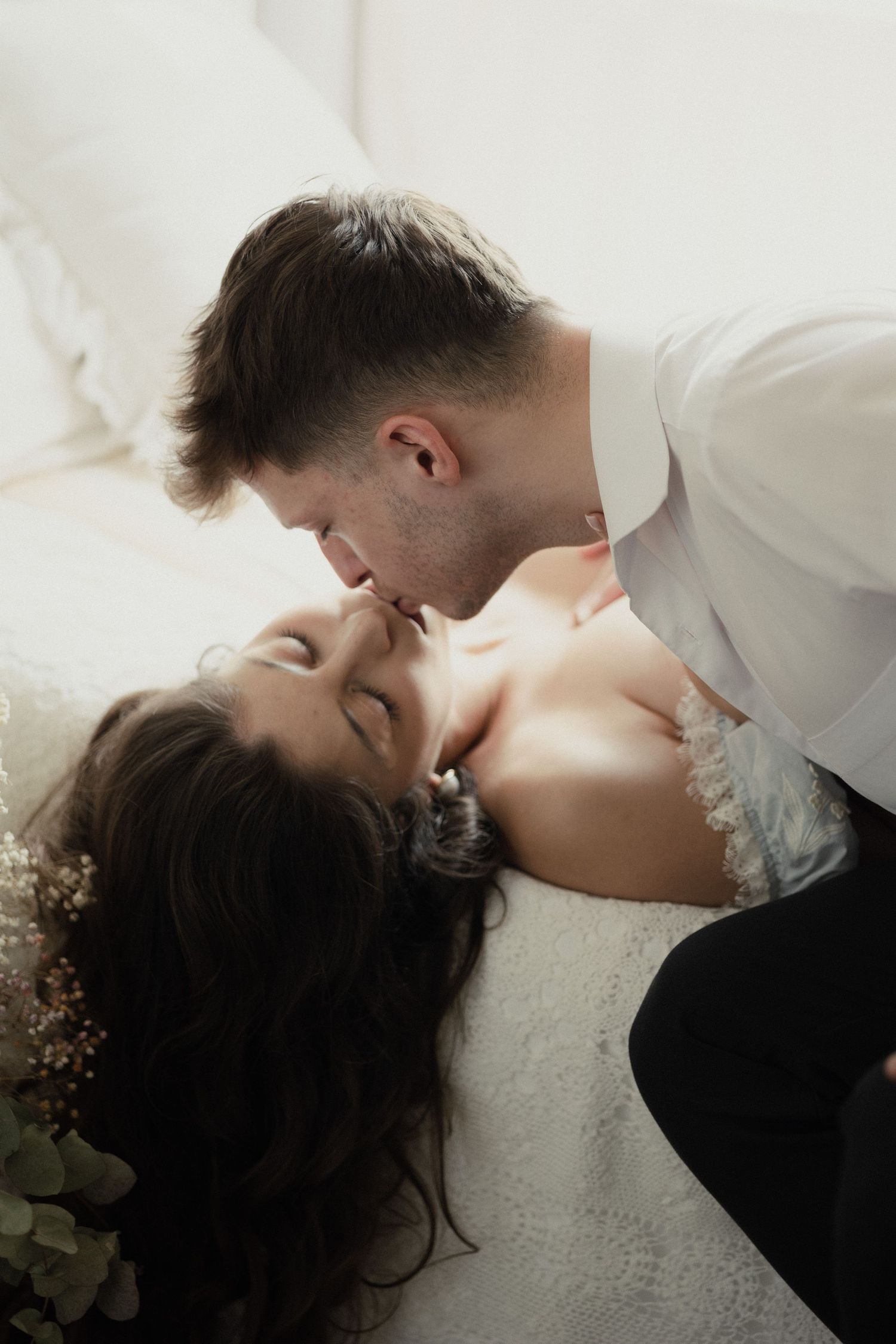 Four romantic wedding photos showing a couple sharing intimate moments against a light background.