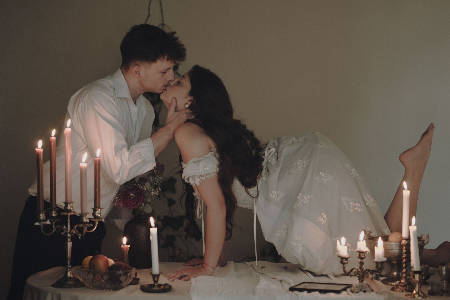 A collage of romantic moments with white candles and elegant decor creates an intimate atmosphere.