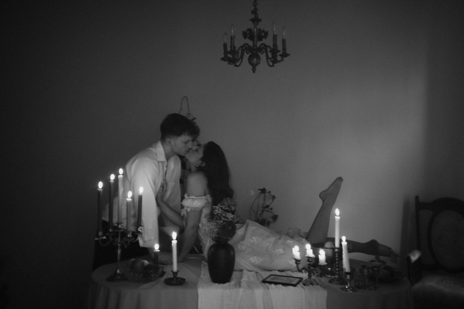 A dreamy black and white series of candlelit scenes with romantic silhouettes and elegant decor creating a moody atmosphere.