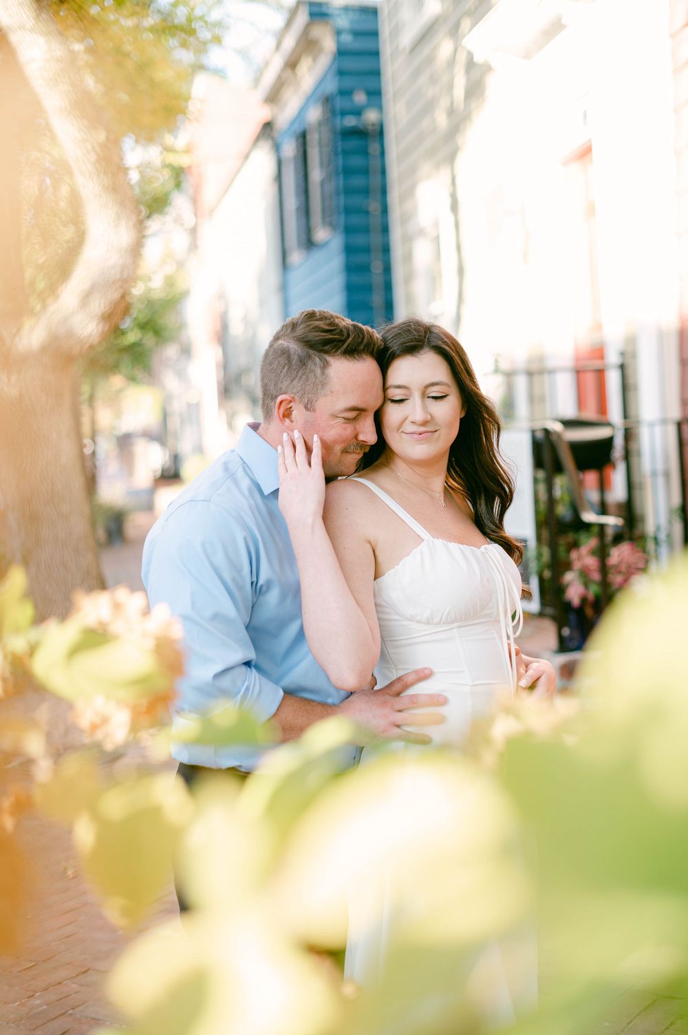Intimate moment between couple during golden hour engagement photoshoot.
