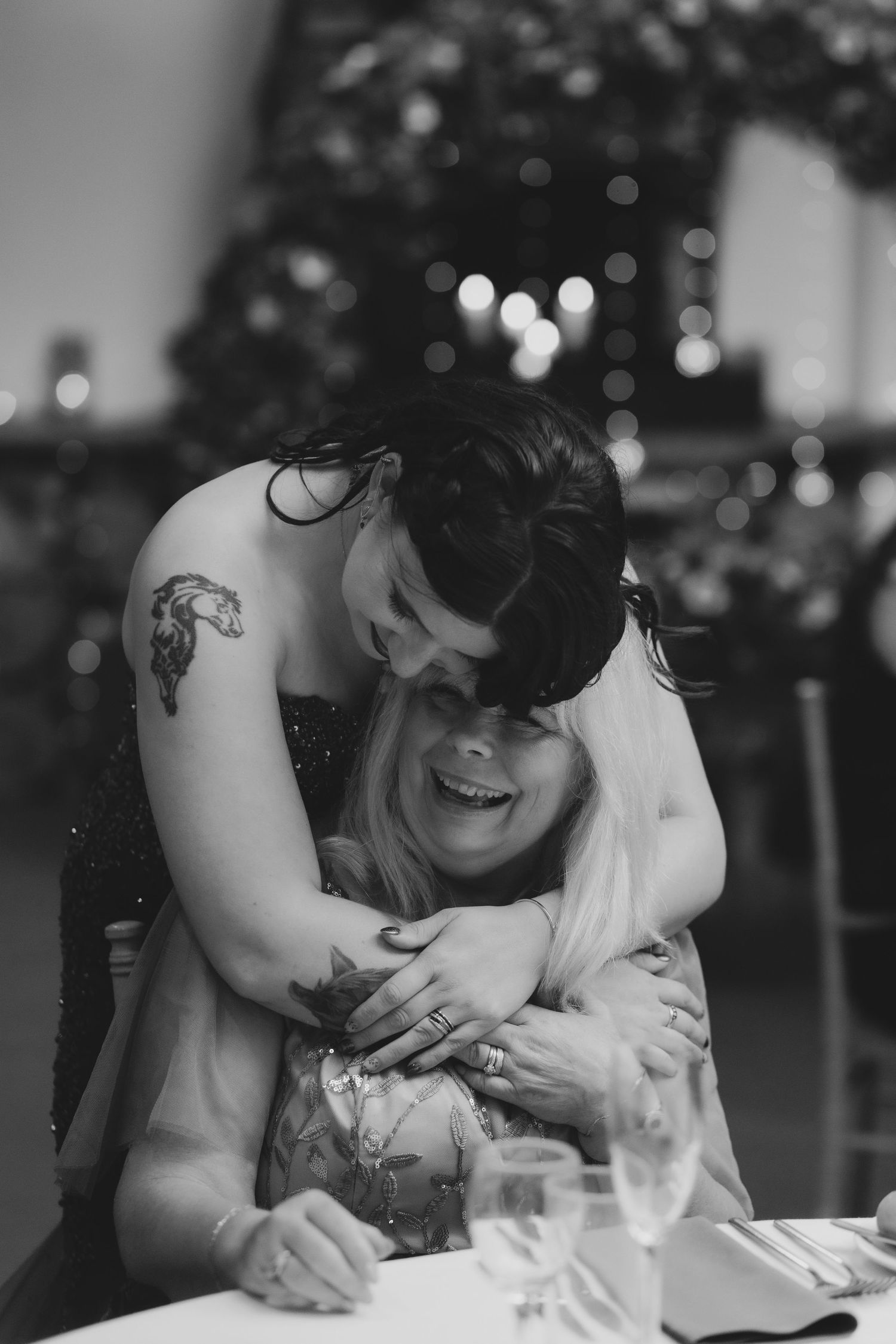 Documentary wedding photography capturing wedding speeches and laughter.