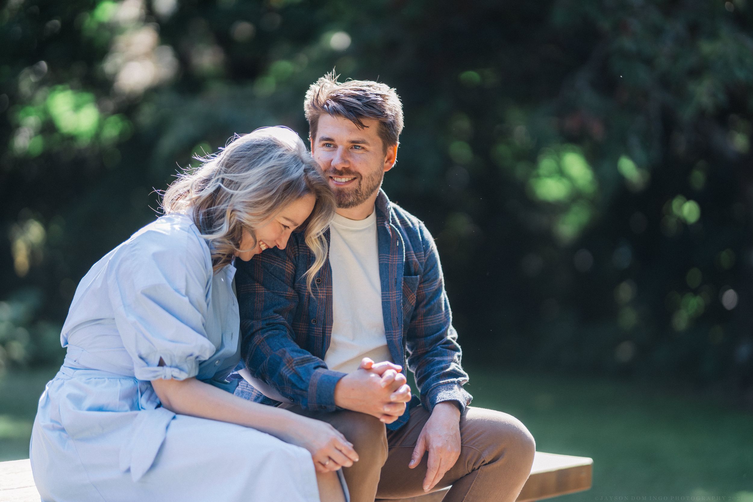 A series of tender outdoor family moments captured in soft natural lighting during a photography session.