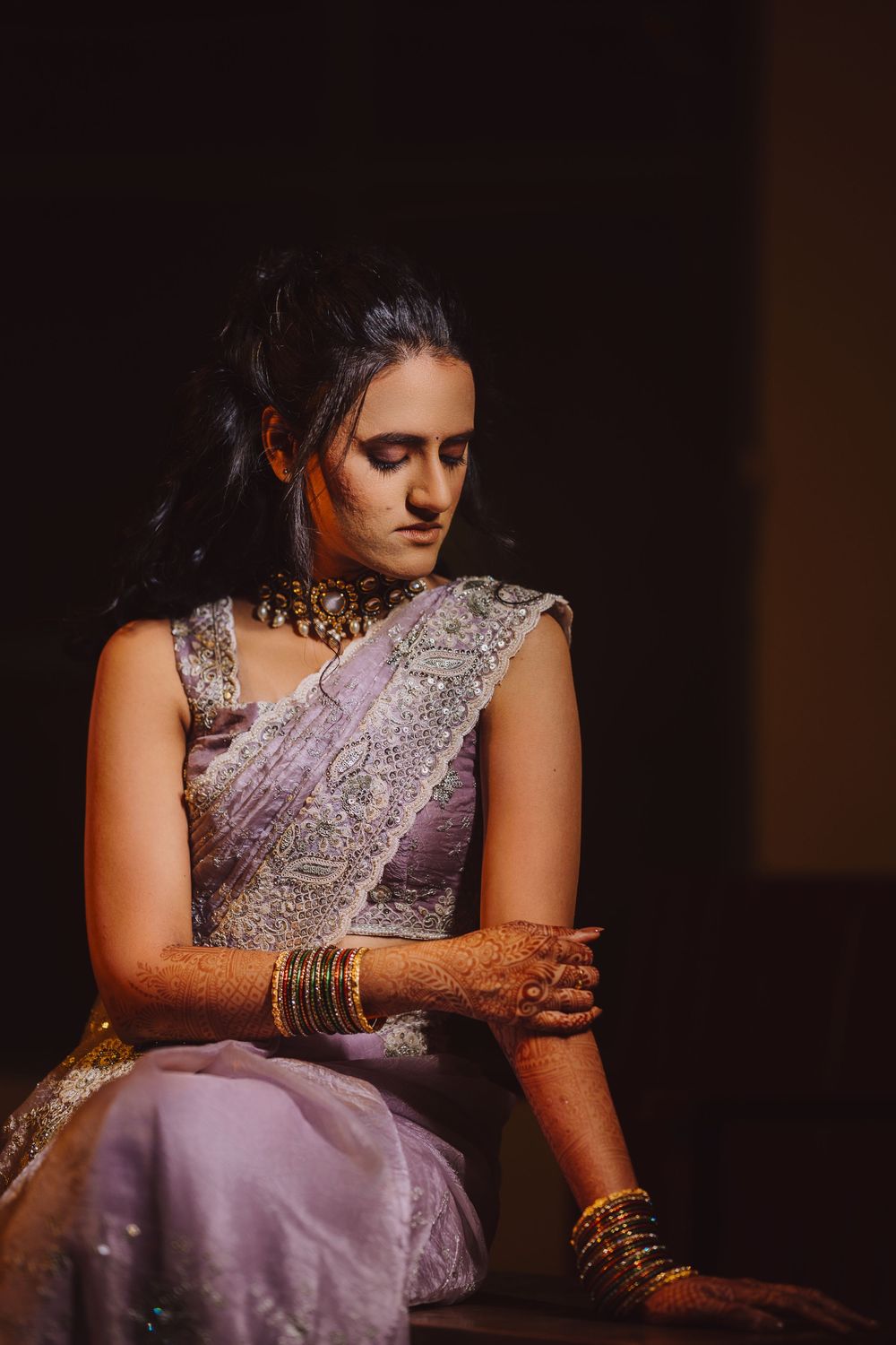 A sequence of photos showing intricate bridal jewelry and a lavender silk sari with detailed embellishments.
