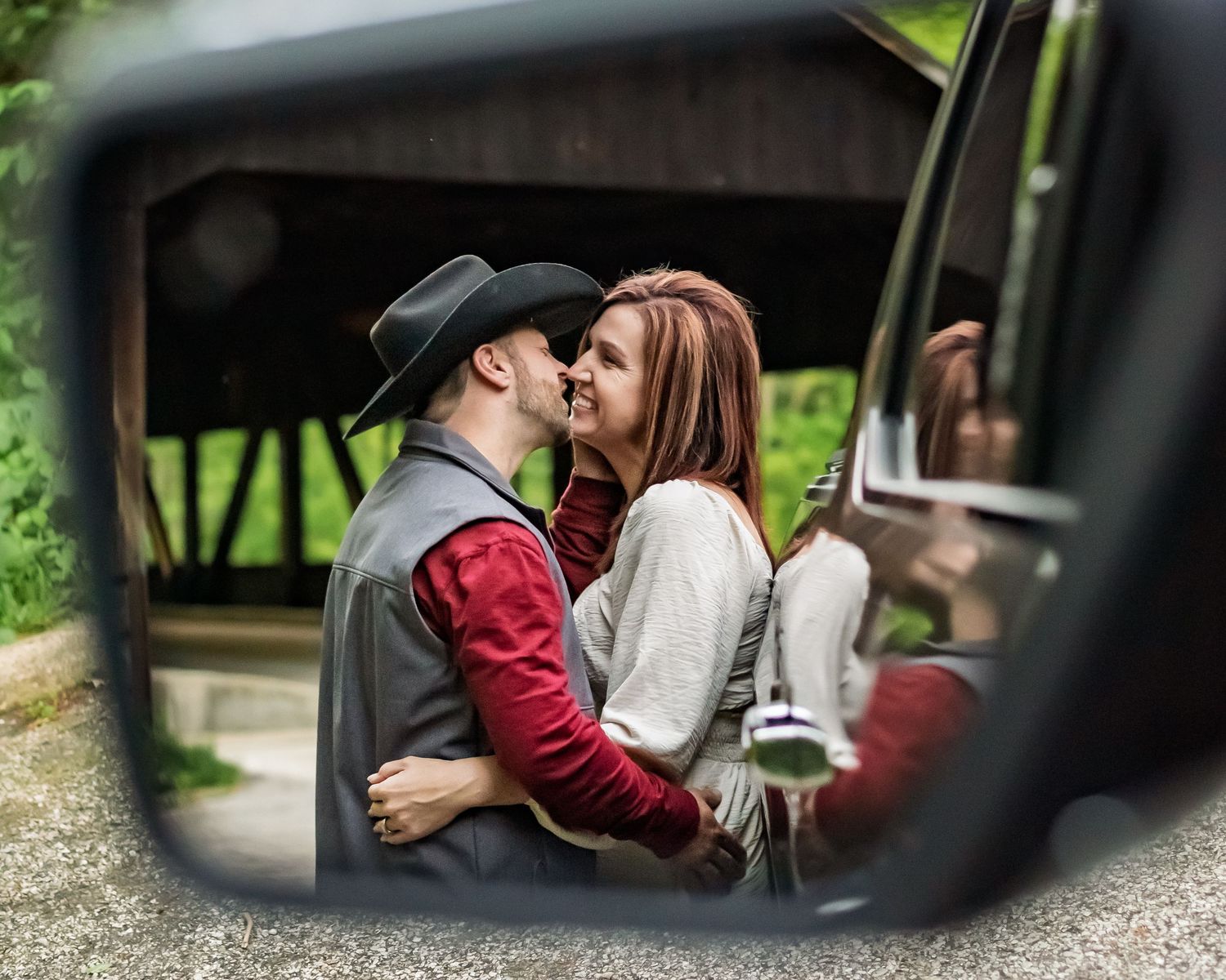 A series of romantic moments captured through car windows in a natural setting.