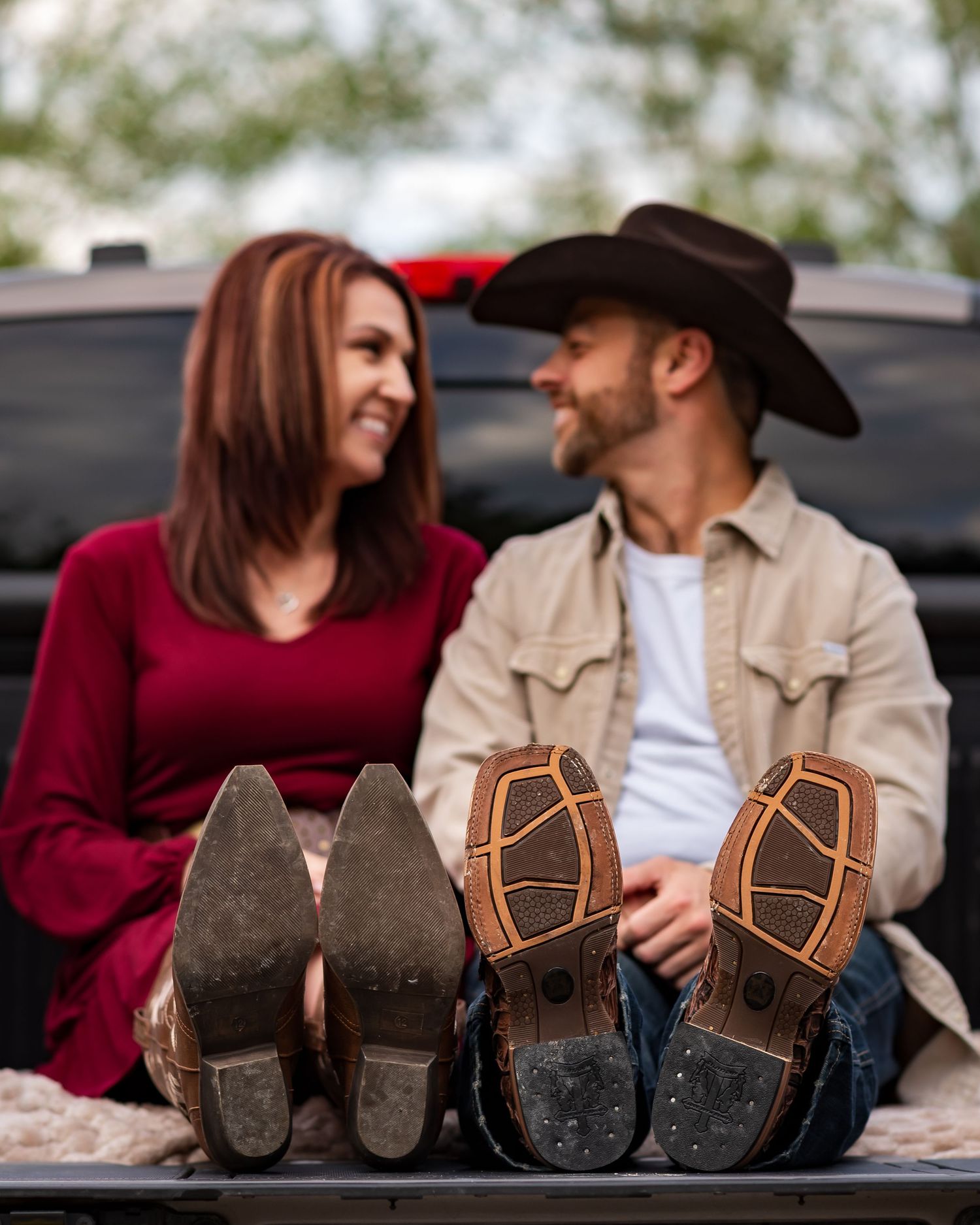 Brown cowboy boots shown side by side with a couple in casual western attire.