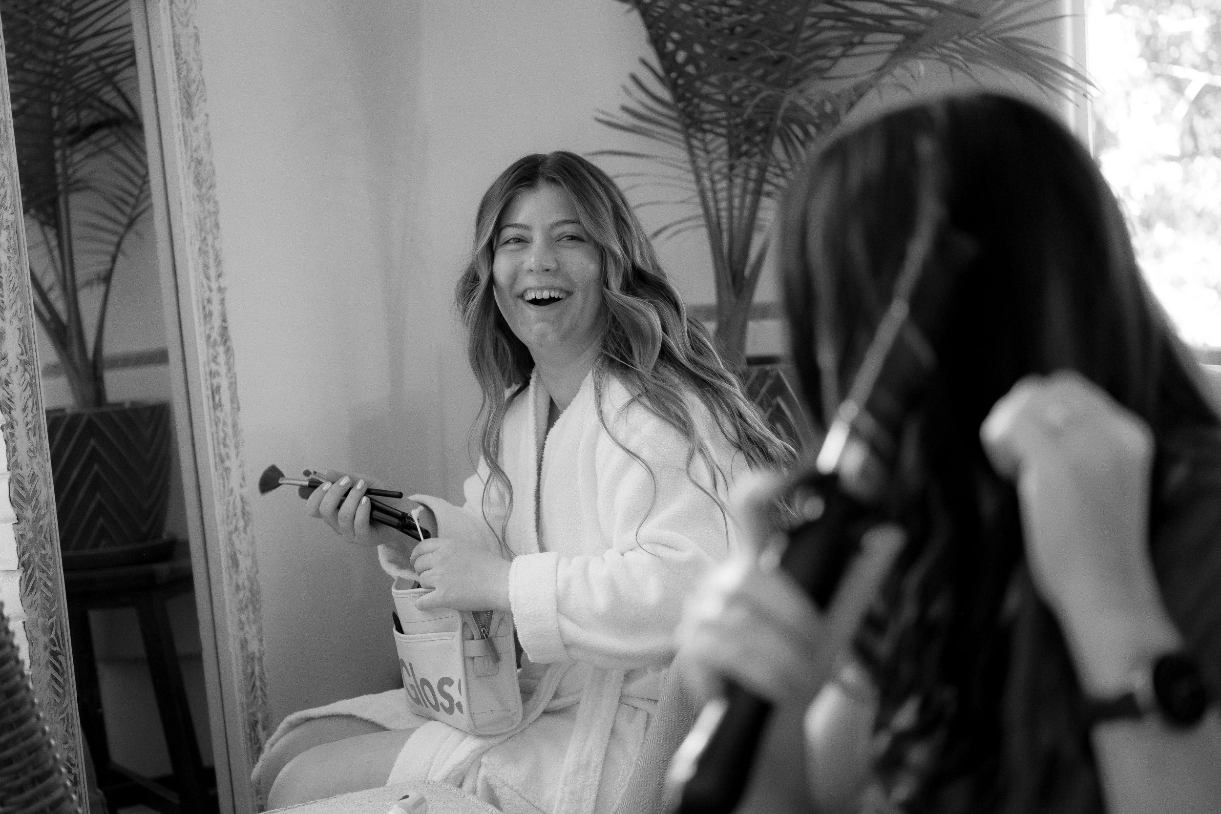 Black and white candid moments during wedding day preparations.