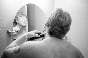 Black and white candid shots capturing intimate moments of wedding day preparations.