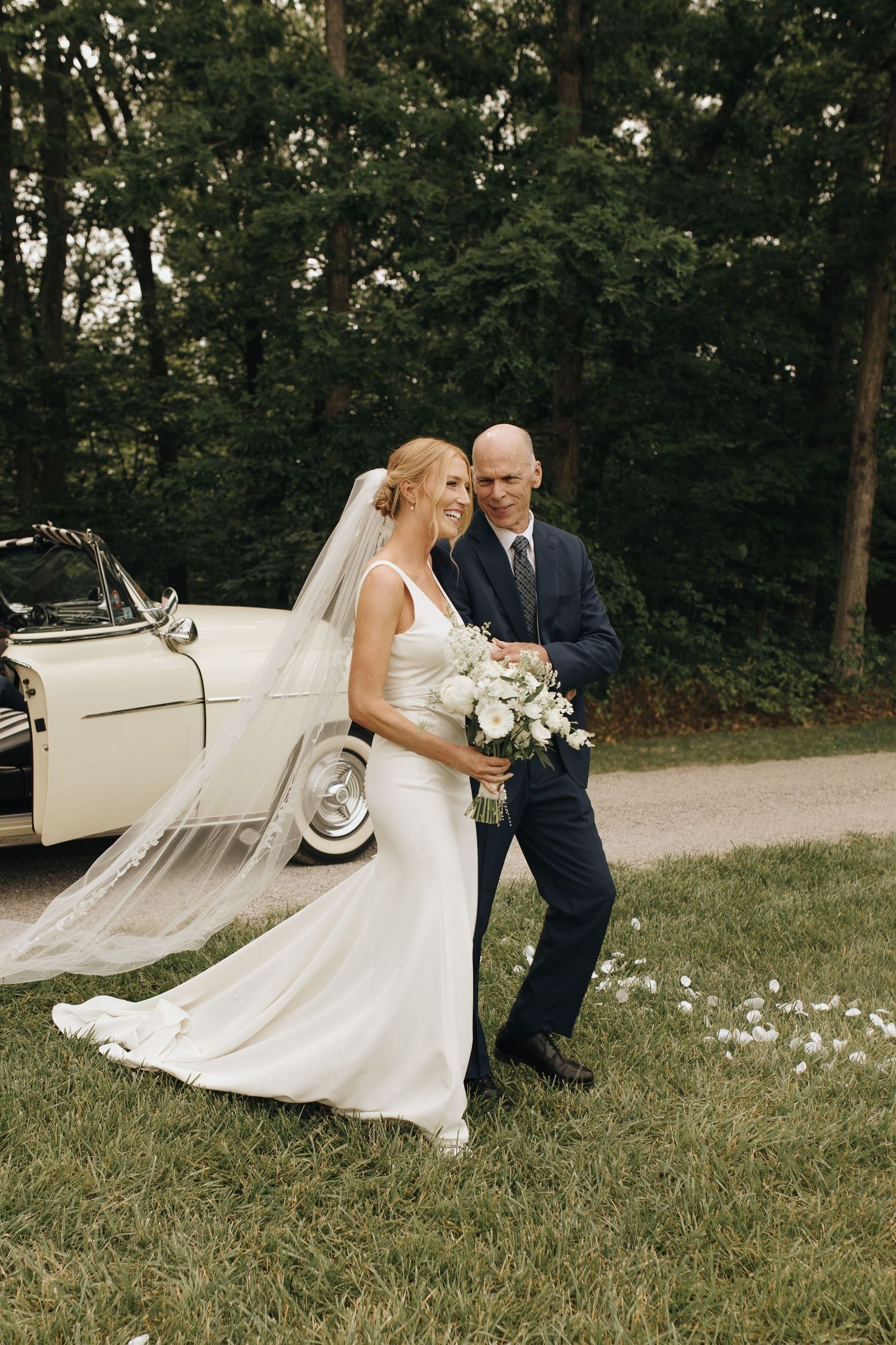Father of the bride taking one last look at his daughter before he walks her down the aisle to her husband.