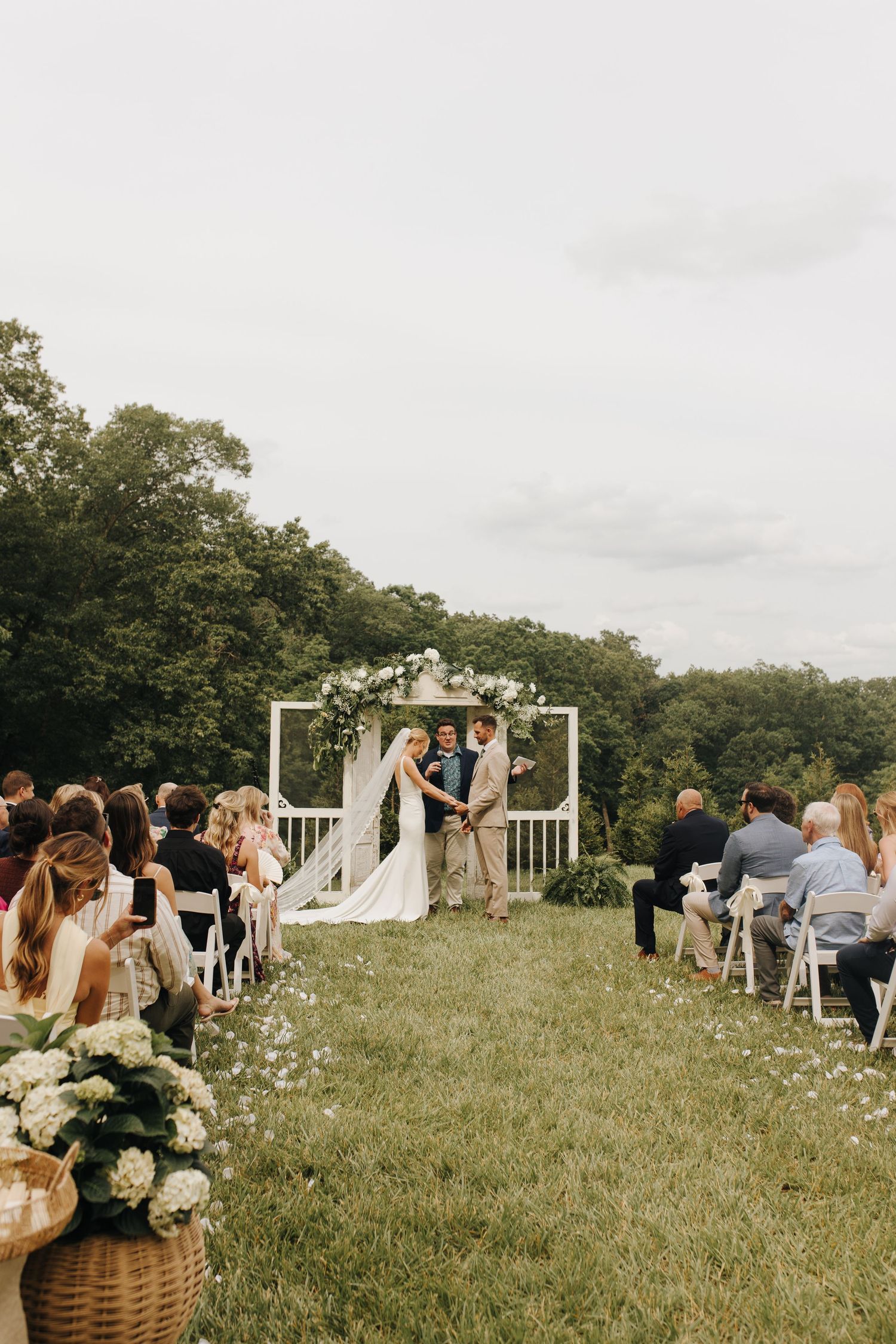 Bride and groom reciting their vows in front of their friends and family.