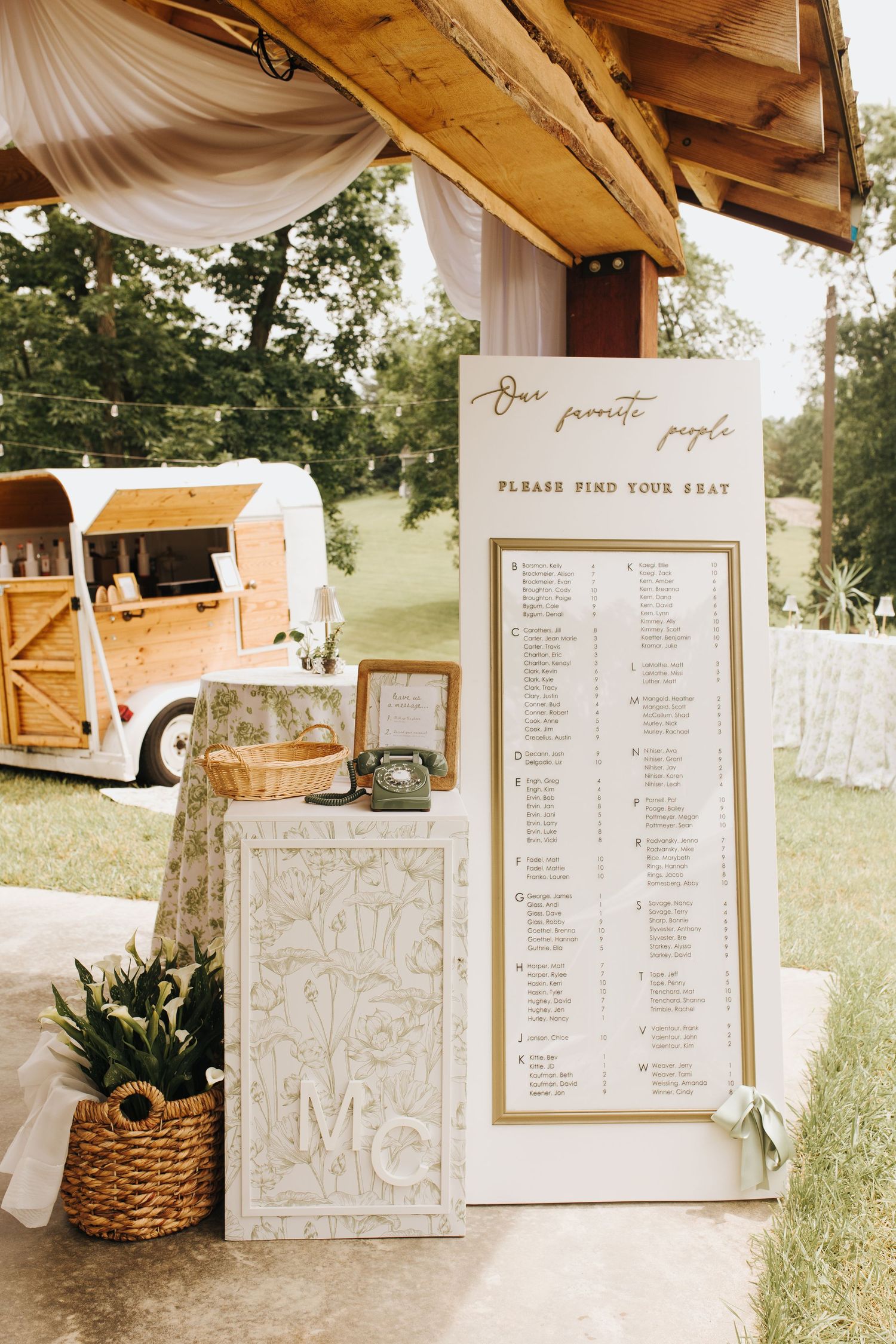Elegant seating chart and retro-style audio guest book inviting guests to leave a voicemail.
