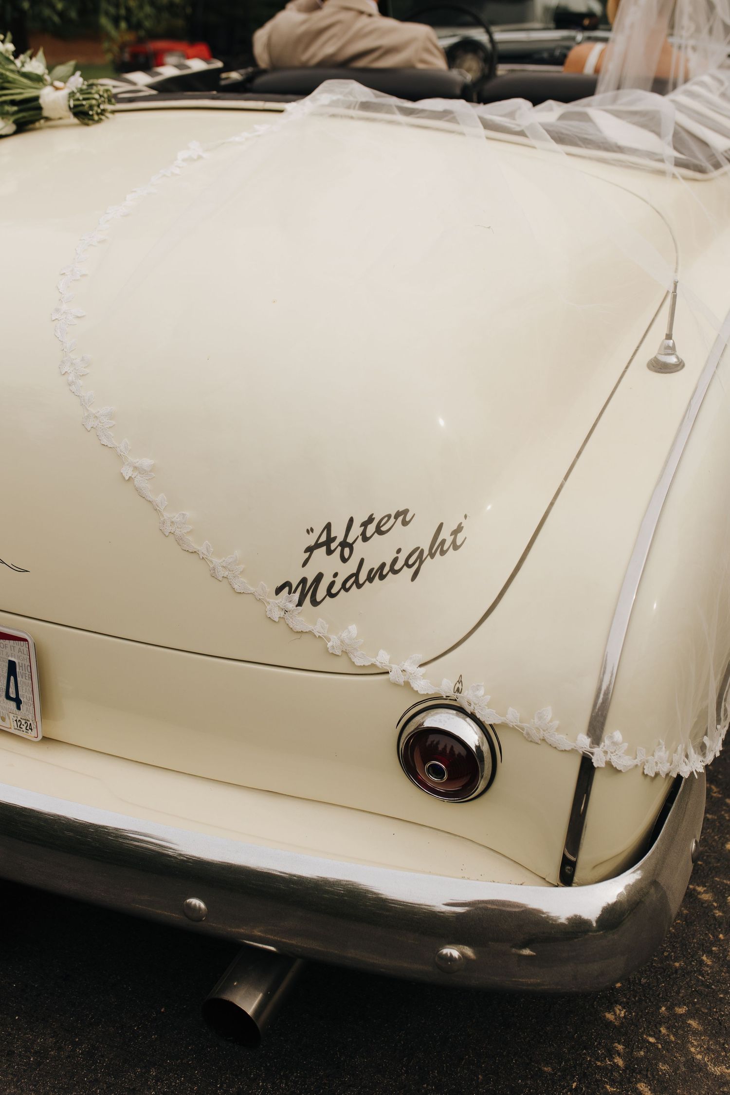 Detail shot of bride's veil hanging off the vintage car - Central Ohio wedding photographer.