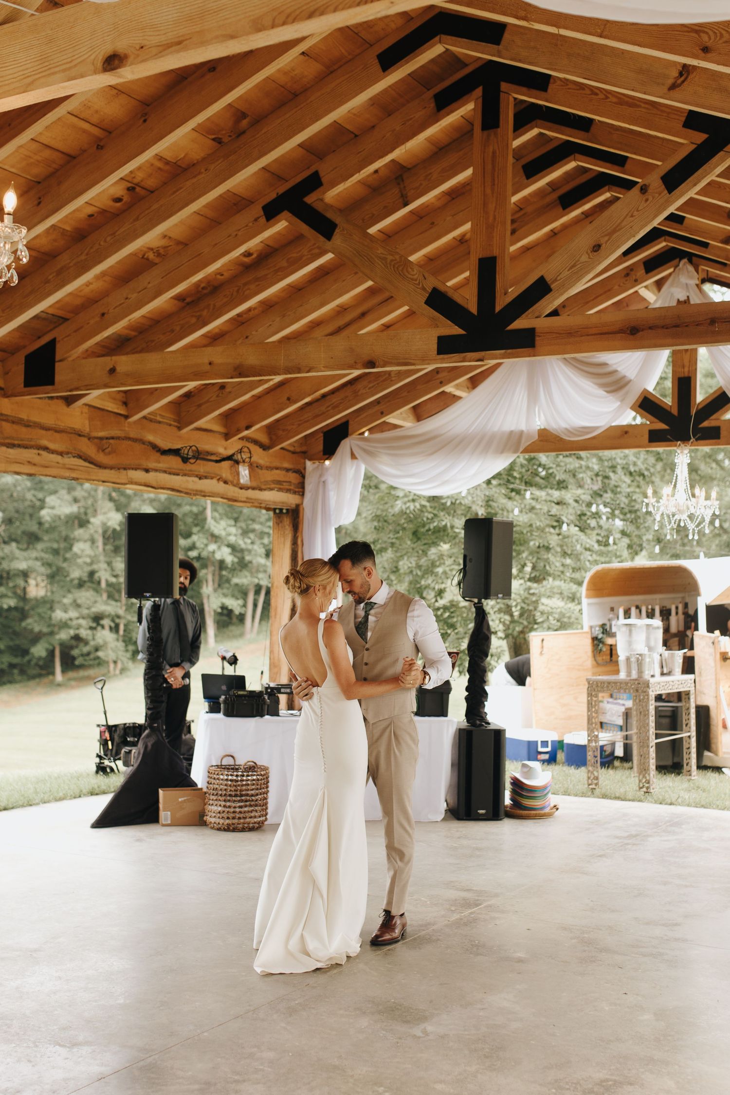 Bride and groom sharing their first dance as husband and wife at their elegant backyard wedding reception in Athens, Ohio.
