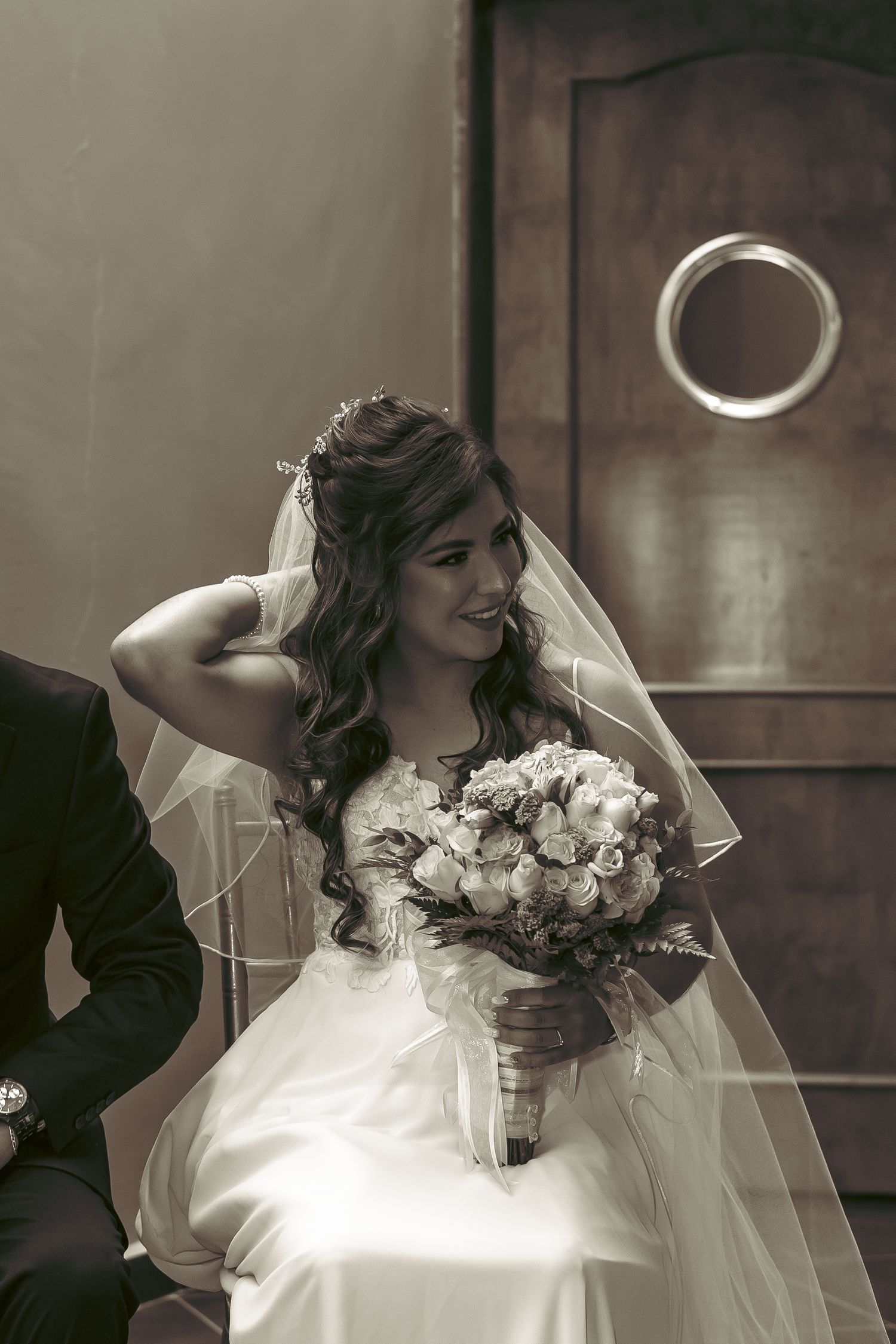 A series of romantic wedding portraits featuring a white bouquet and flowing veil.