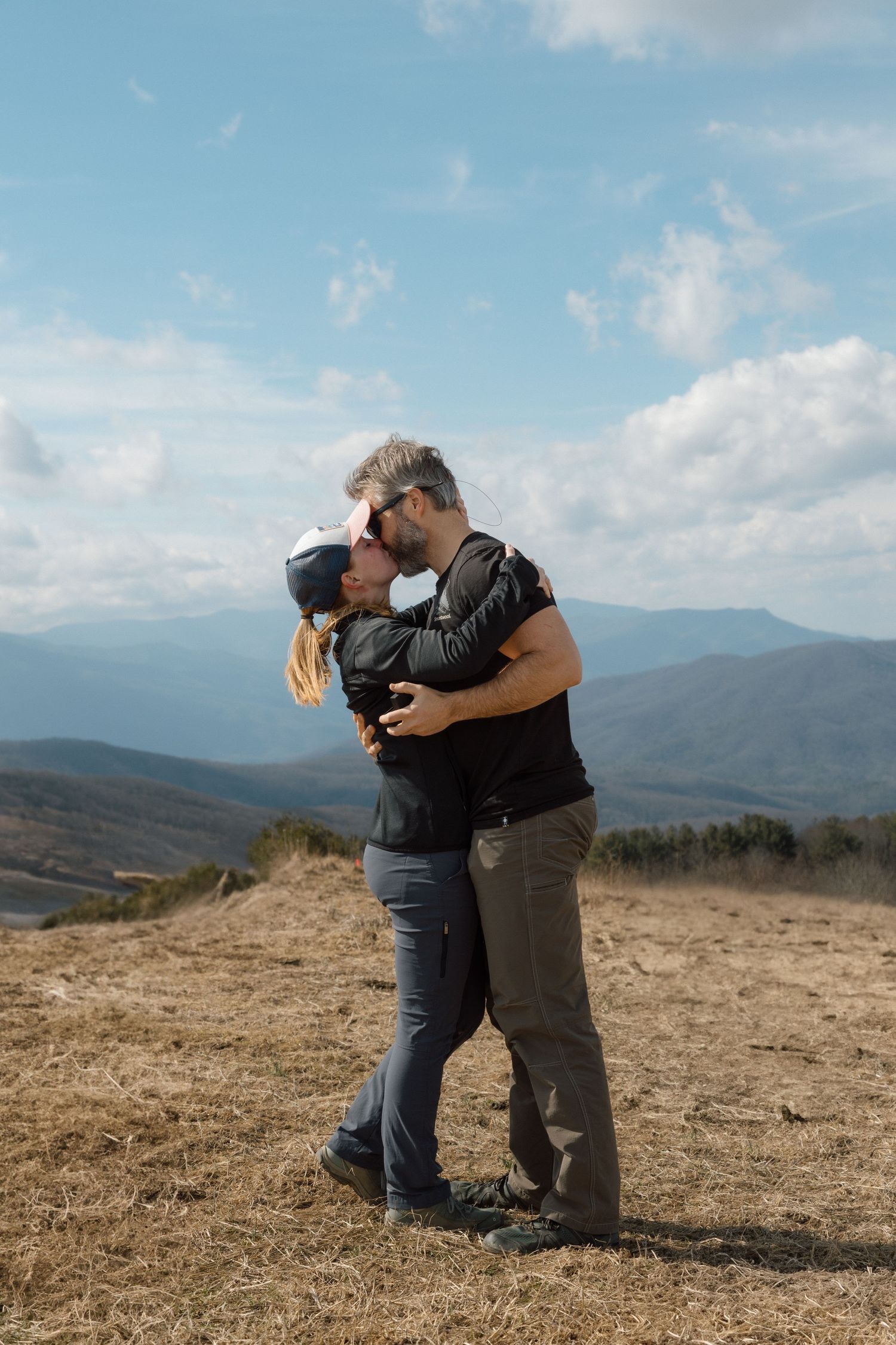 unique couple proposing at blue ridge mountain overlook near Asheville, North Carolina
