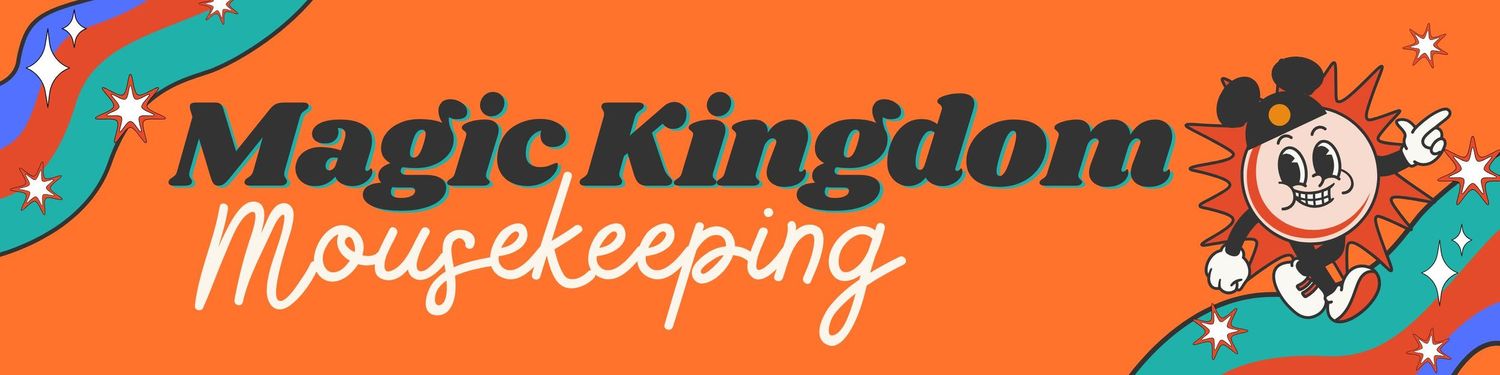 An orange and teal Magic Kingdom sign with classic Mickey Mouse artwork at Disney World.