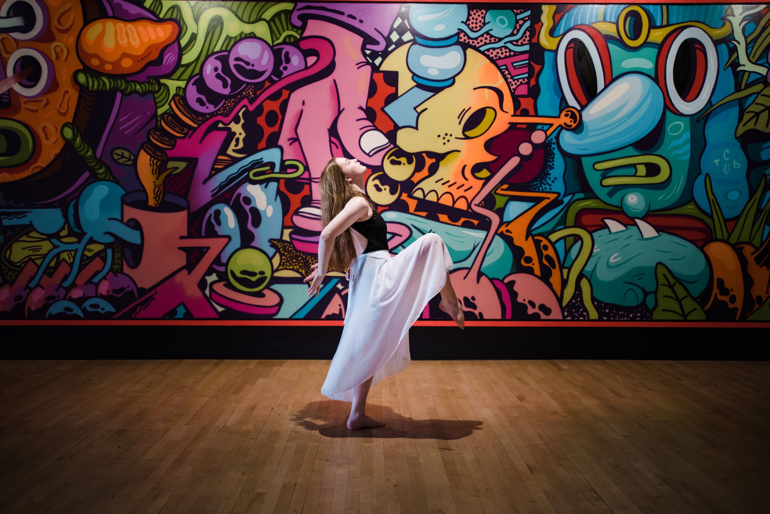 Memphis family photographer specializing in capturing authentic, everyday moments that reflect your senior. Ballerina at Crosstown Concourse