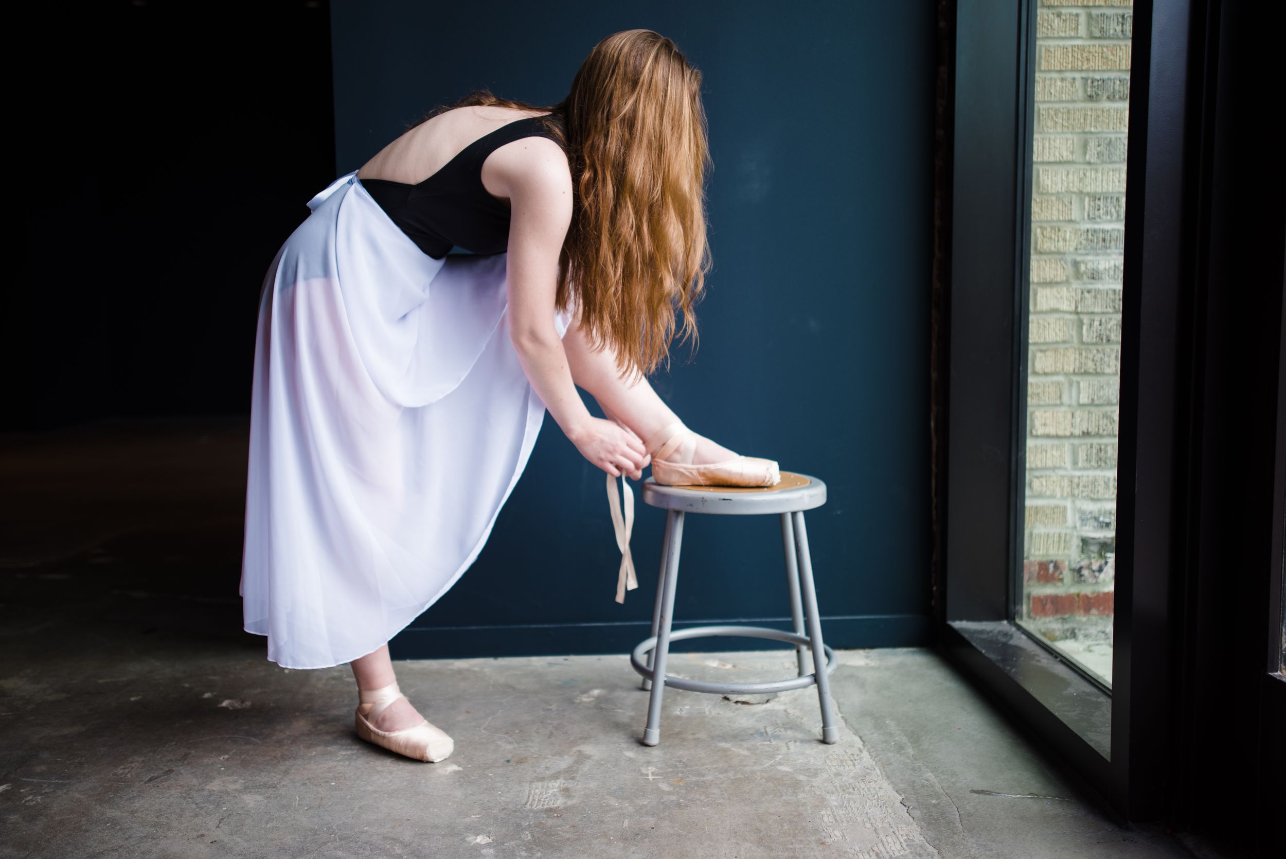 Memphis family photographer specializing in capturing authentic, everyday moments that reflect your senior. Ballerina at Crosstown Concourse
