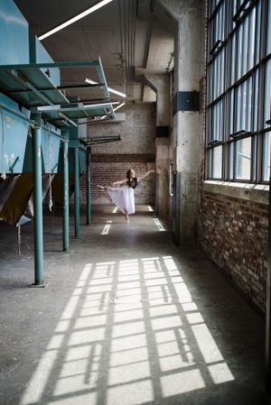 Memphis family photographer specializing in capturing authentic moments that reflect your senior. Ballerina at Crosstown Concourse