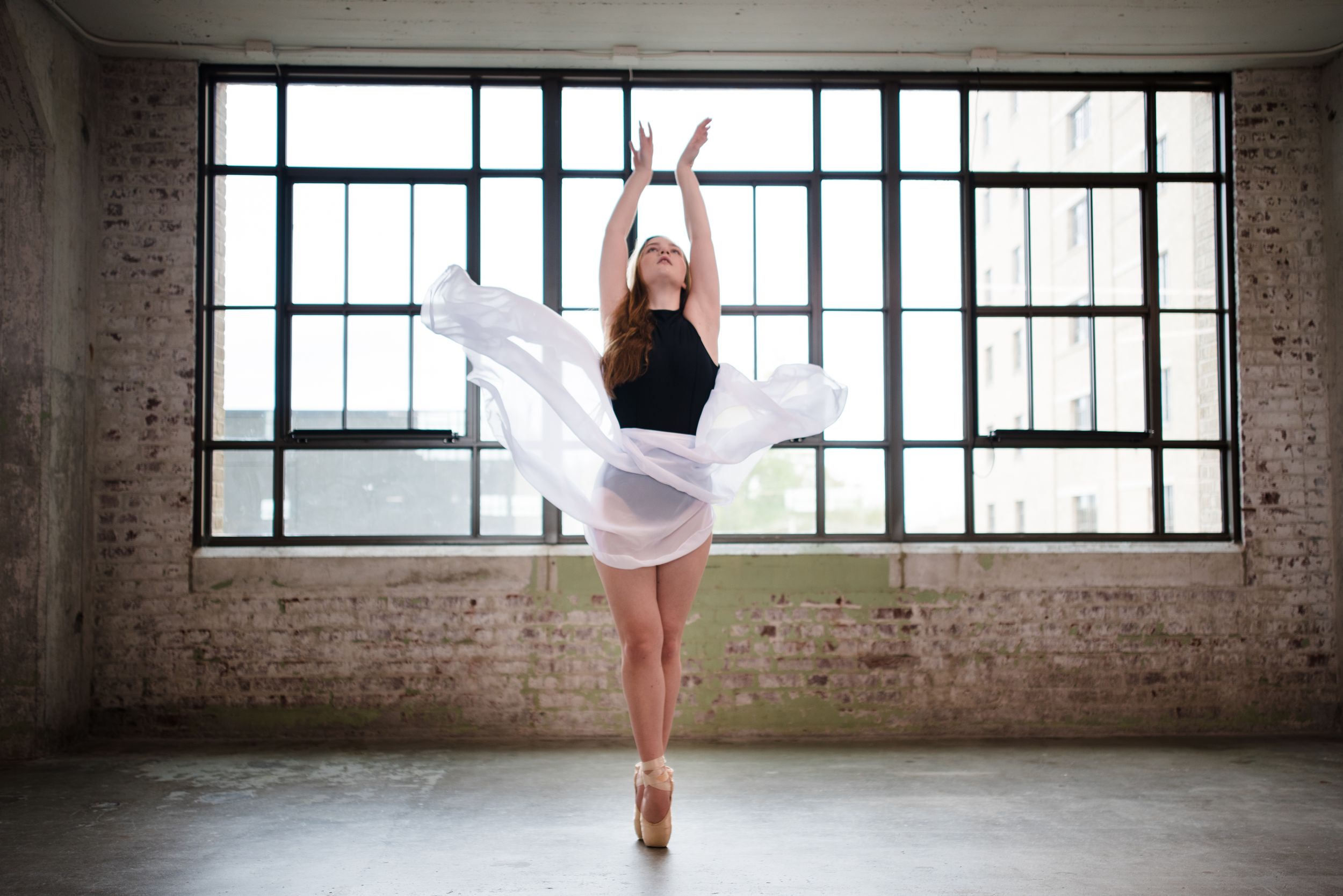 Memphis family photographer specializing in capturing authentic, everyday moments that reflect your senior. Ballerina at Crosstown Concourse