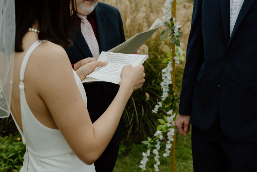 bride reading vows during ceremony