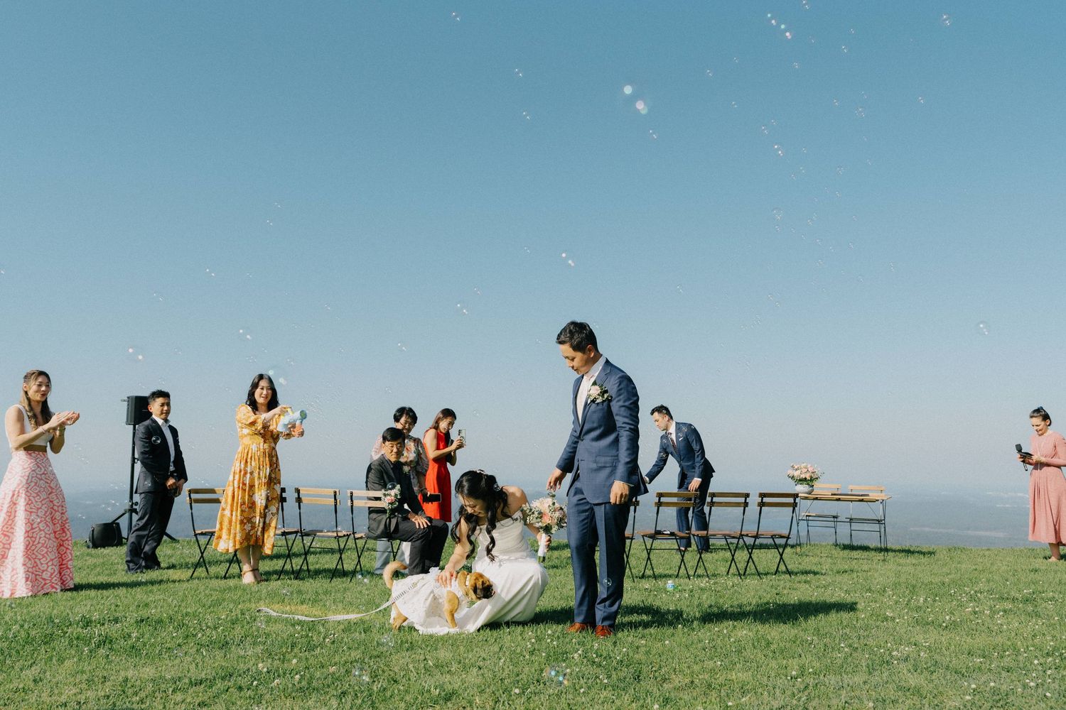 "Sunshine Coast bride hugging her dog during wedding ceremony"