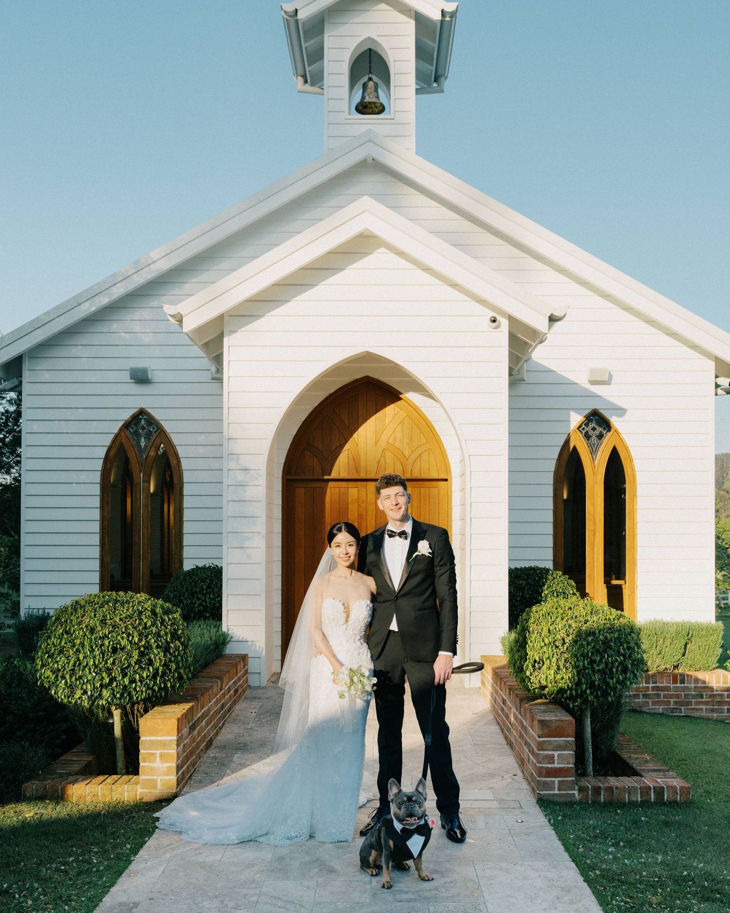 "Dog sitting by bride’s side during vows at Sunshine Coast wedding"