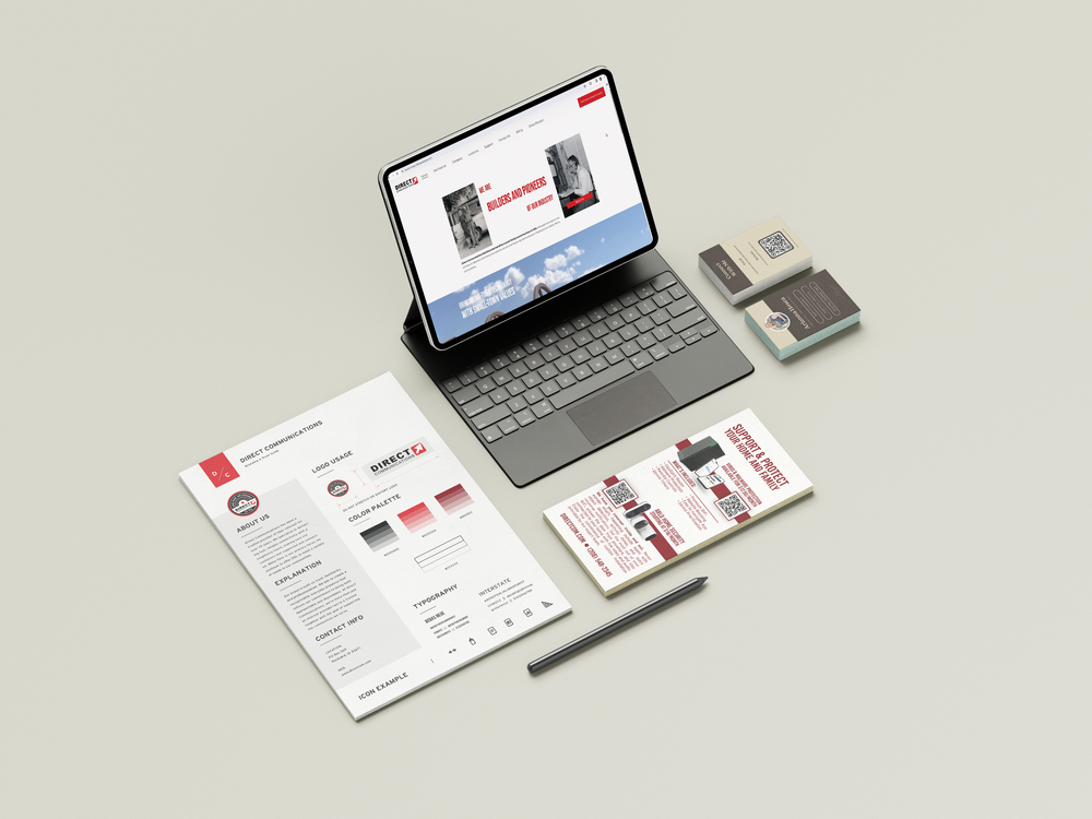 Minimalist white business cards and laptop mockups displayed with matching monochromatic branding materials.