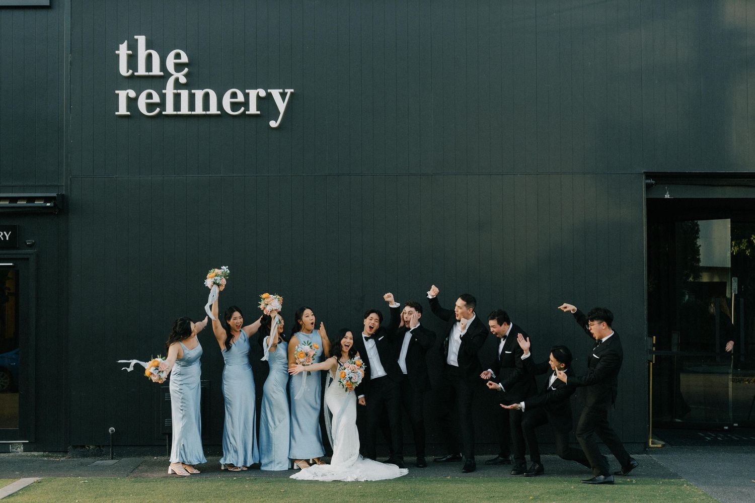 Bridal party celebrating at The Refinery in Brisbane, captured by a candid wedding photographer
