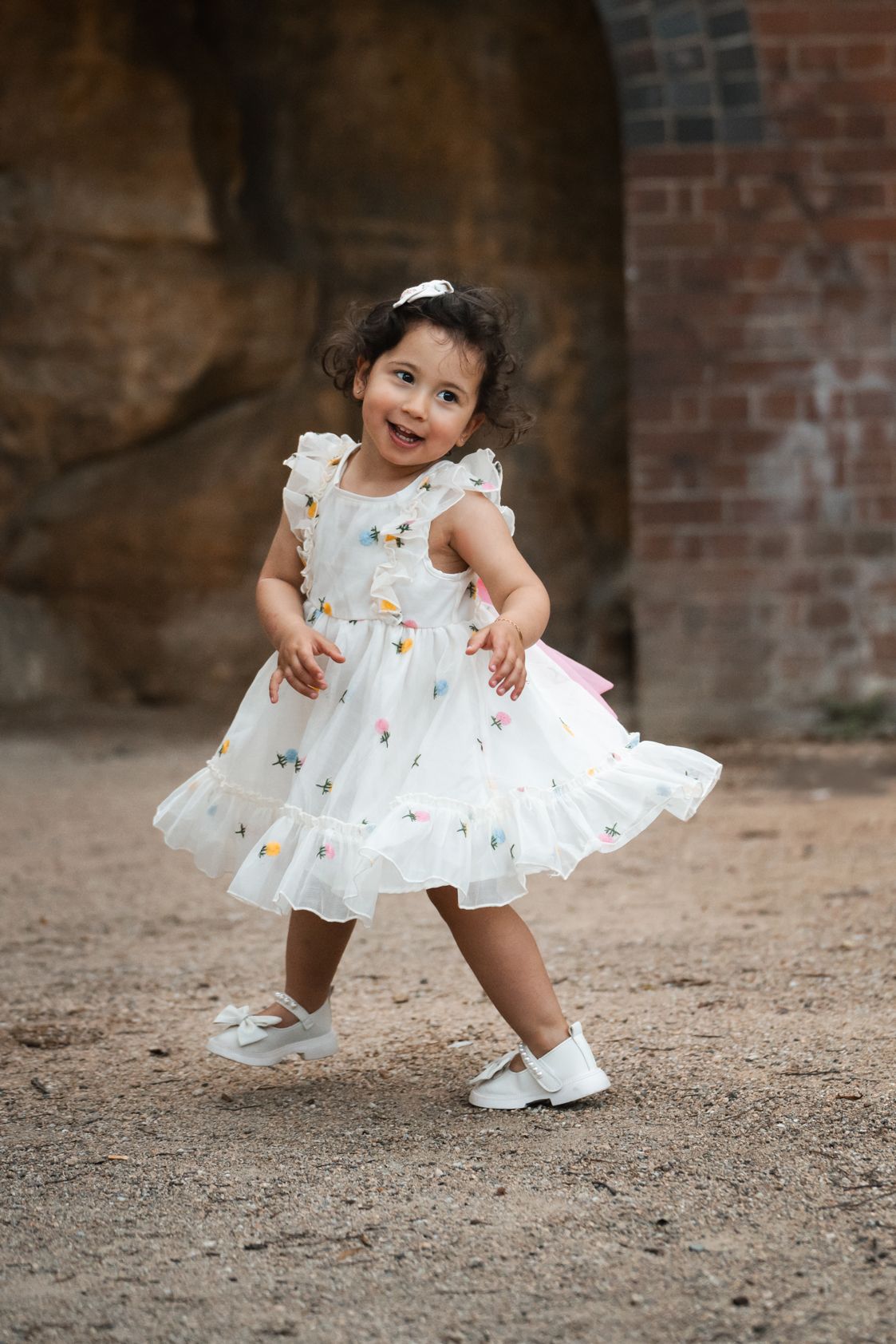 a happy girl dancing during a photoshoot in Sydney city