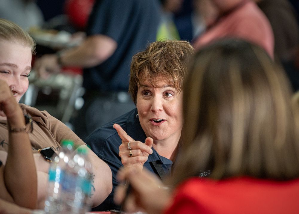 Candid moments of people laughing and smiling during a workplace event.