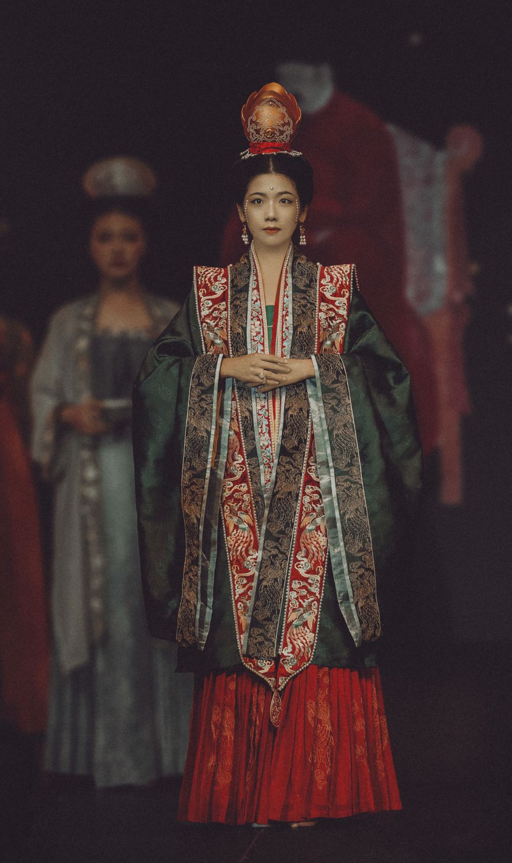 Dramatic stage photography of a traditional Hanfu fashion show featuring elegant performers, by an Auckland event photographer.