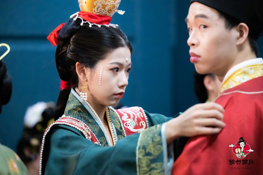 Dramatic stage photography of a traditional Hanfu fashion show featuring elegant performers, by an Auckland event photographer.