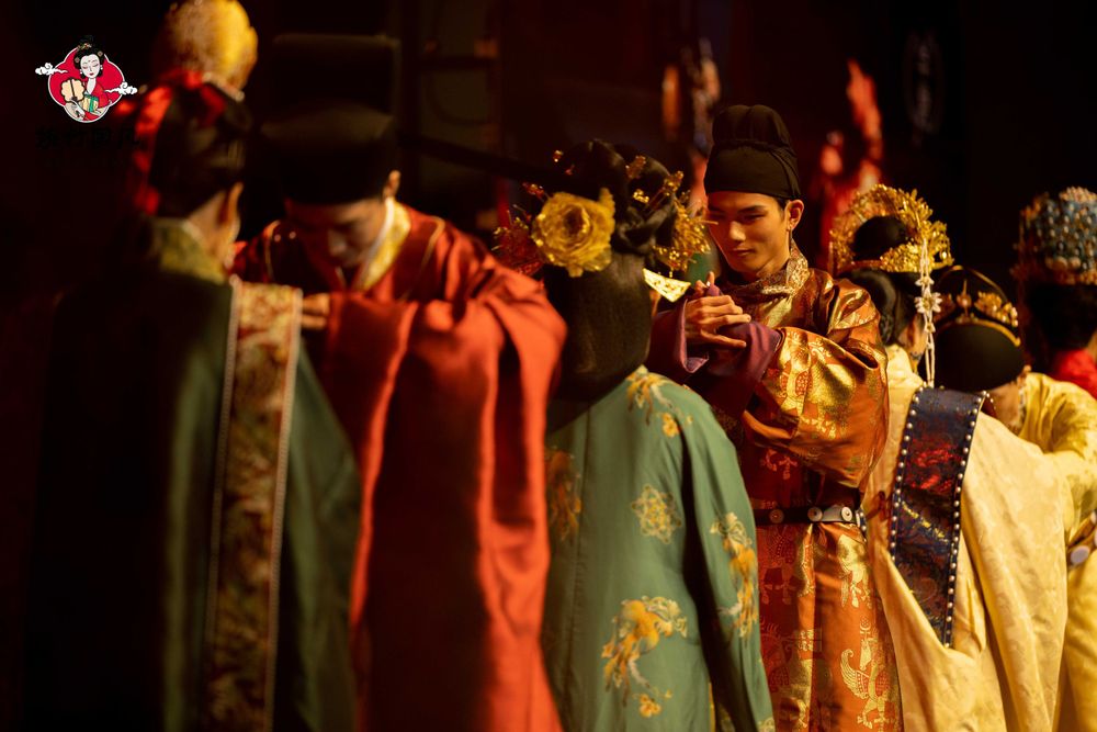 Dramatic stage photography of a traditional Hanfu fashion show featuring elegant performers, by an Auckland event photographer.