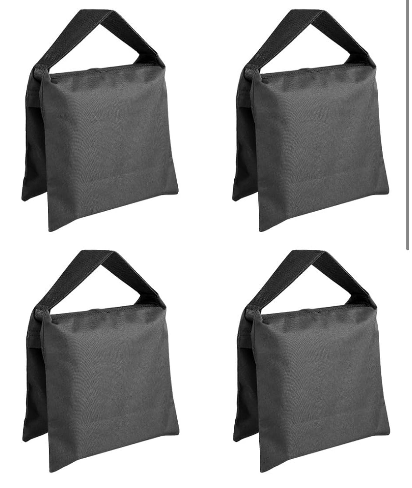 Four identical heavy-duty grey sandbag weights with black handles for photography and film production equipment.