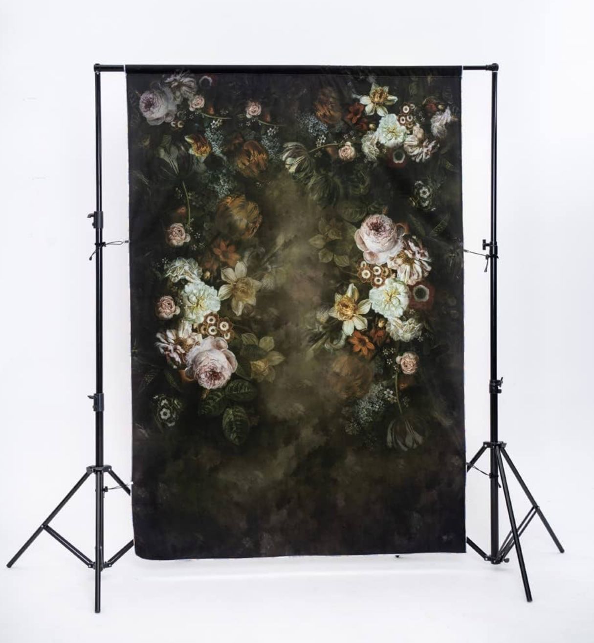 Dark vintage photography backdrop with moody floral design featuring white and orange roses against a shadowy background.