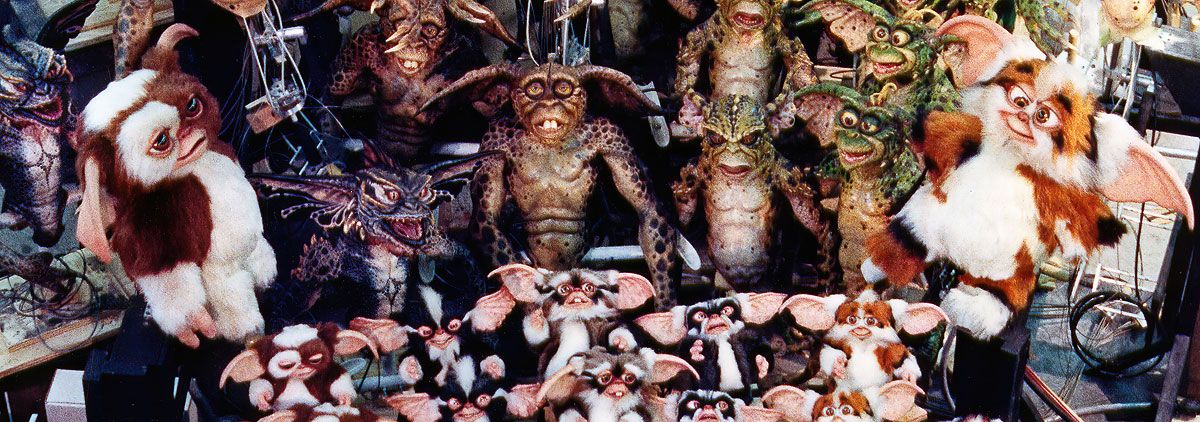 Wide shot of mogwai and Gremlin puppets