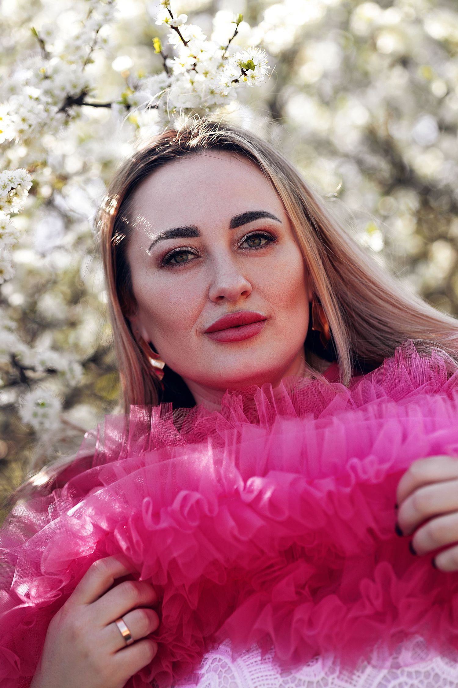 woman in blooming trees Lithuania