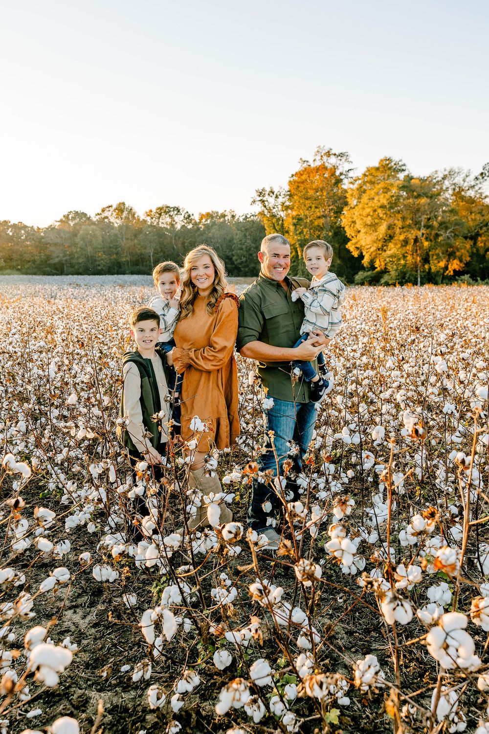 Timeless family photos in a McConnells, SC cotton field—warm hues, gentle breezes, and candid smiles amid the cotton rows.