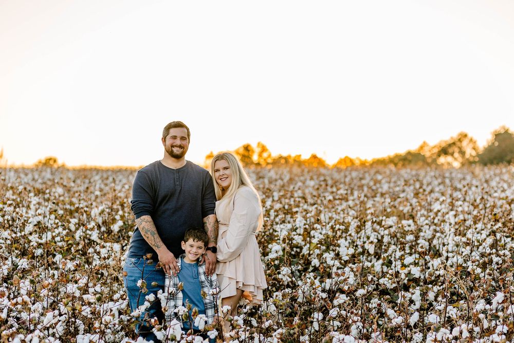 Joyful family session in a Clover, SC cotton field—fluffy bolls, soft evening light, and genuine moments together.