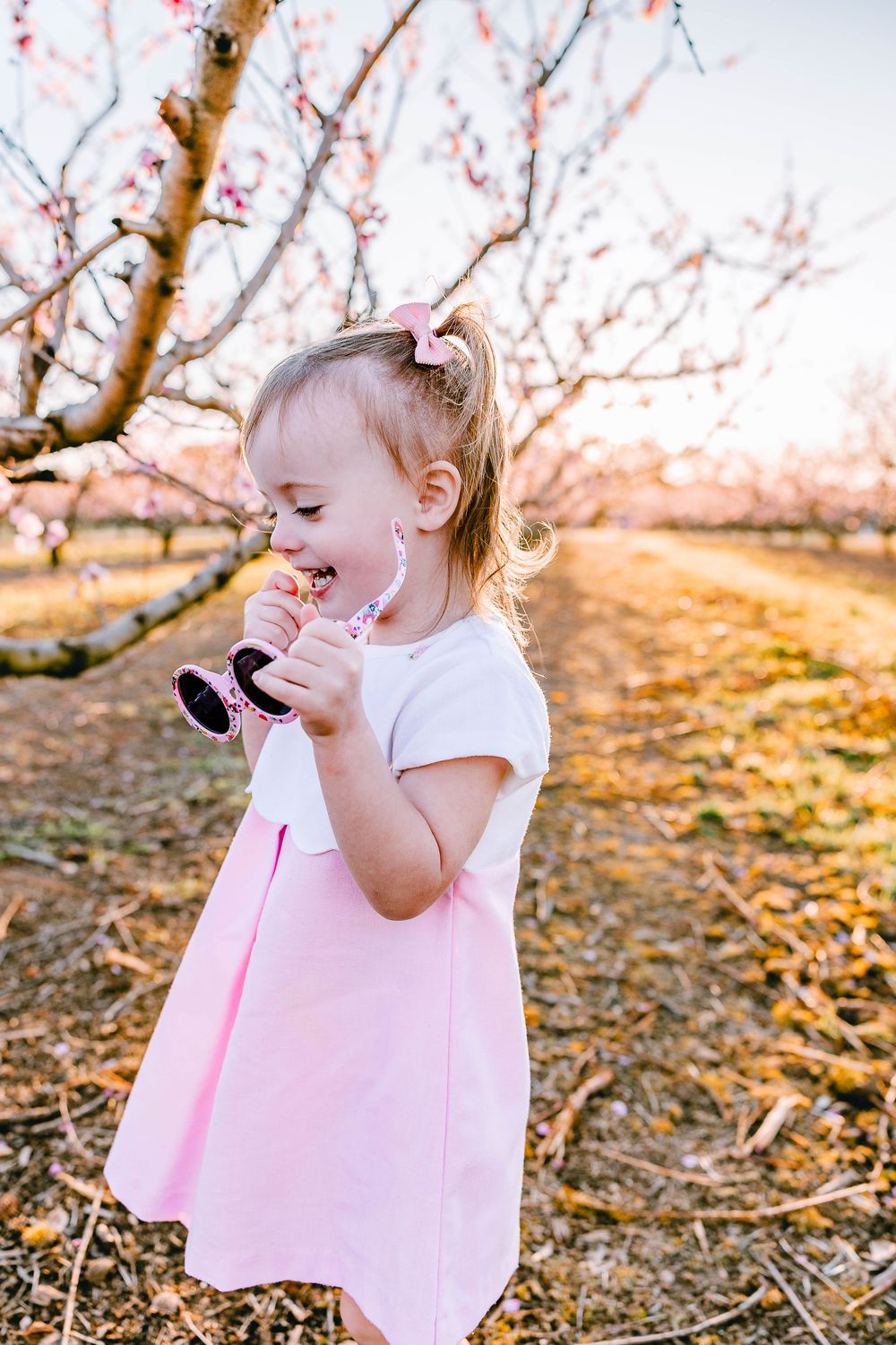 Surrounded by peach blossoms and giggles—this Clover, SC moment is everything.