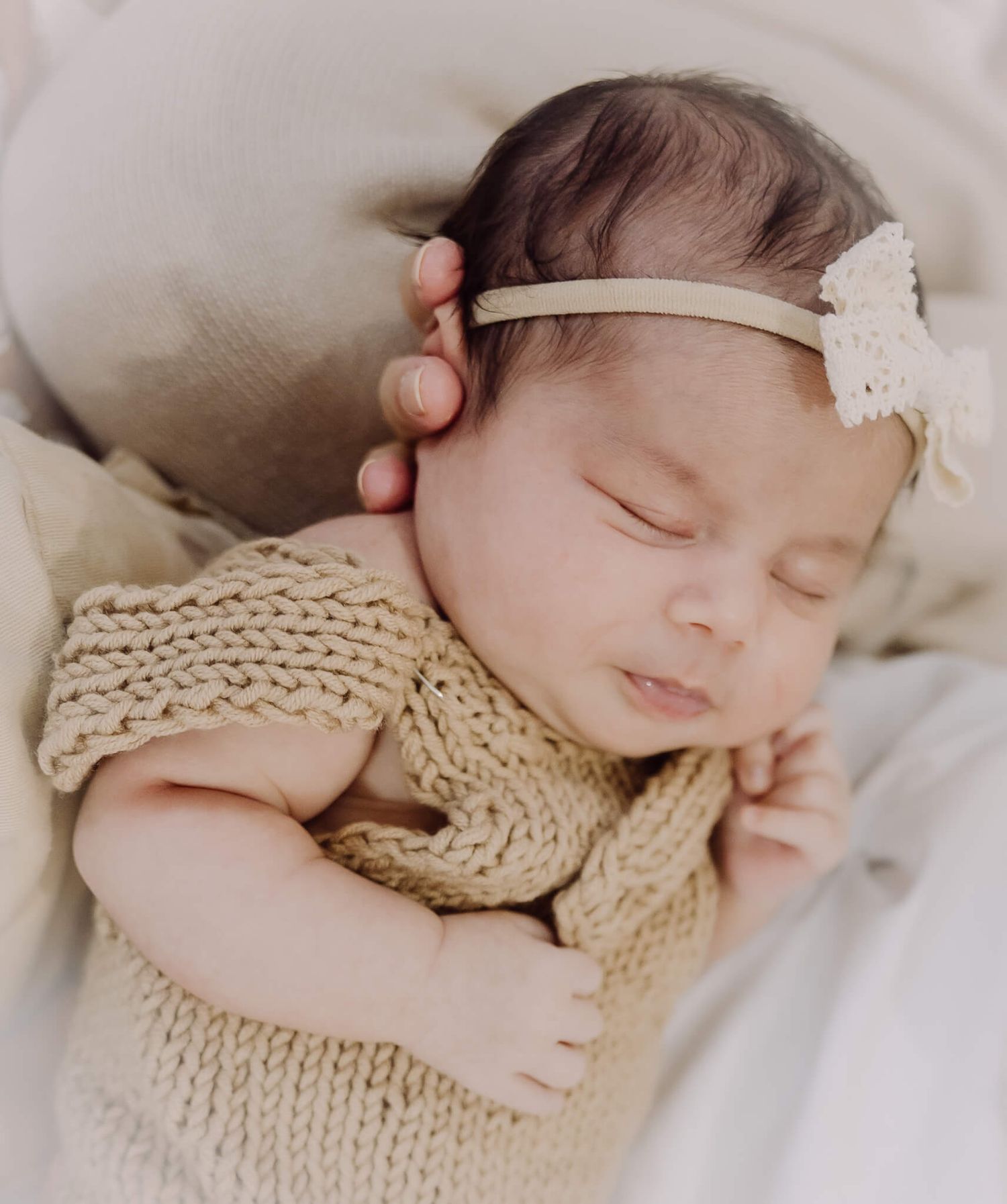 Newborn baby peacefully sleeping in a cozy Fremont home during lifestyle session