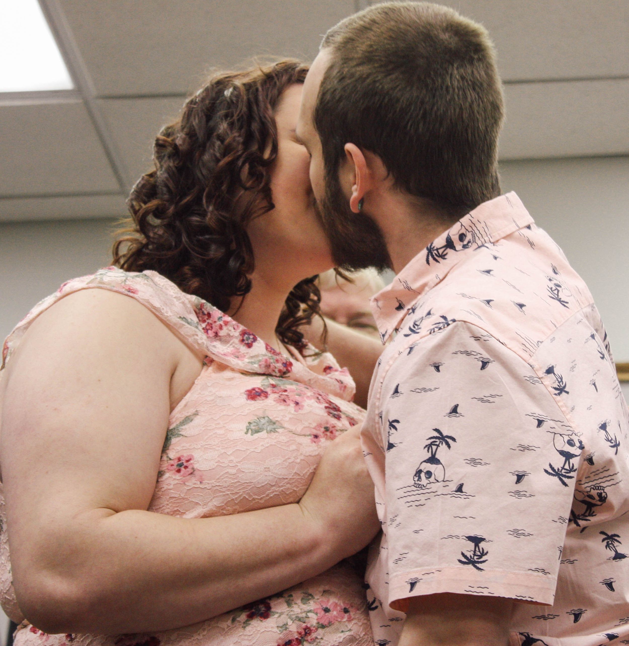 A couple embraces in a series of romantic photos showing affection and closeness.