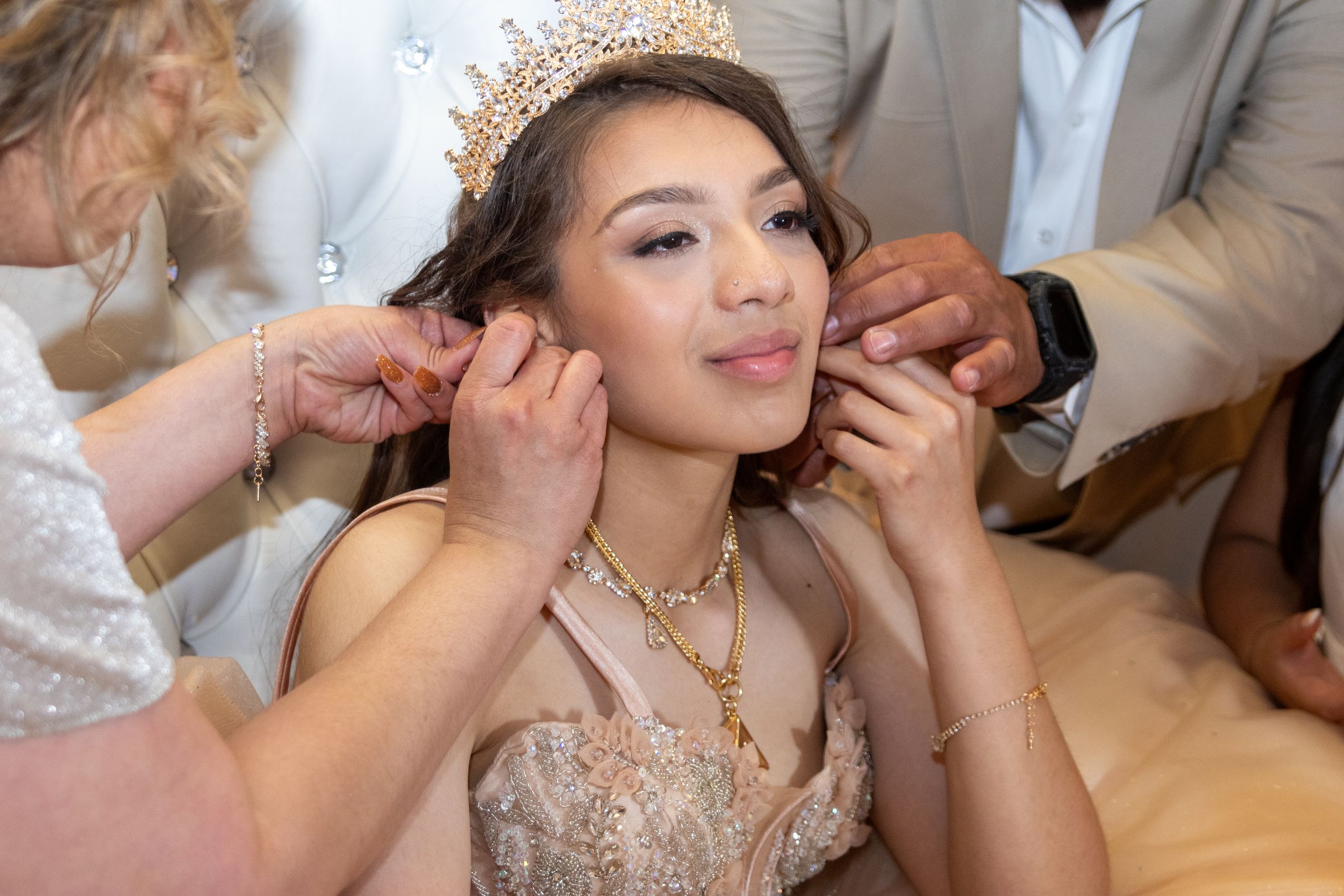 Elegant celebration scene with formal attire and jewelry.