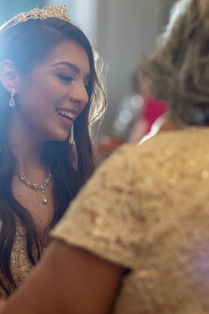 Elegant party scene with soft lighting and sparkly formal attire.