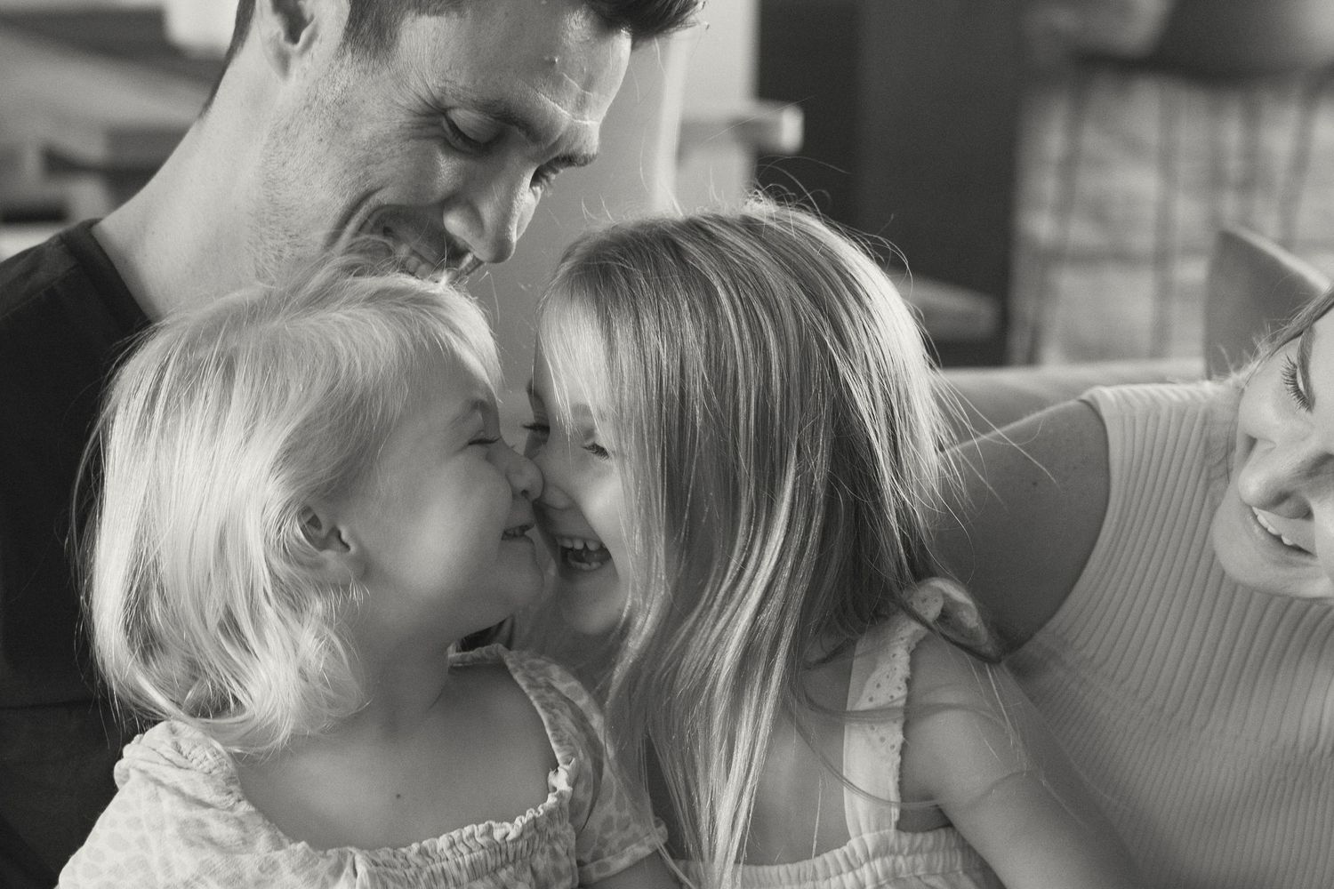 A romantic black and white photo sequence showing a couple sharing tender kisses and intimate moments together.