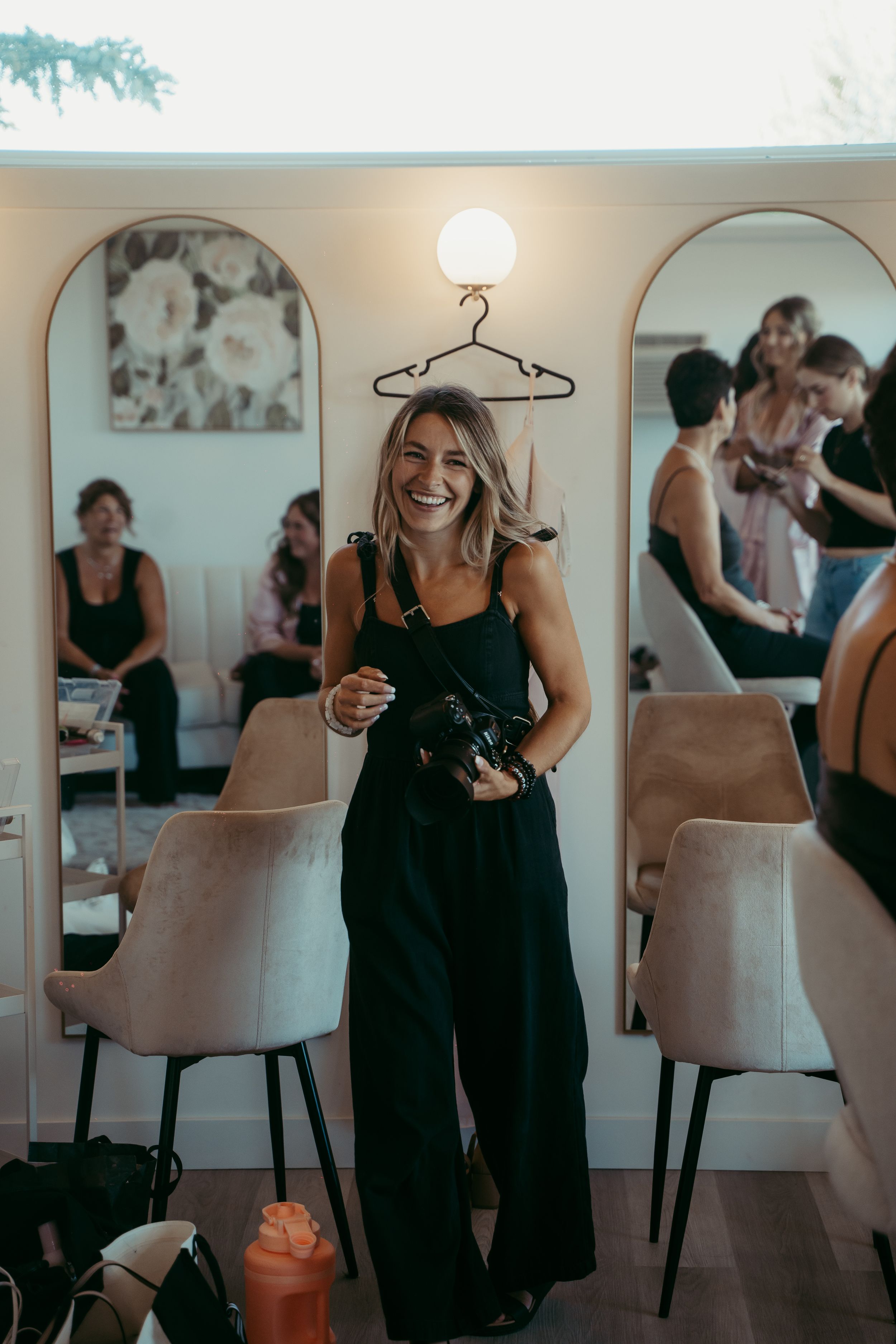 Candid shot at an indoor gathering showing laughter and joy in a room with contemporary decor and soft lighting.
