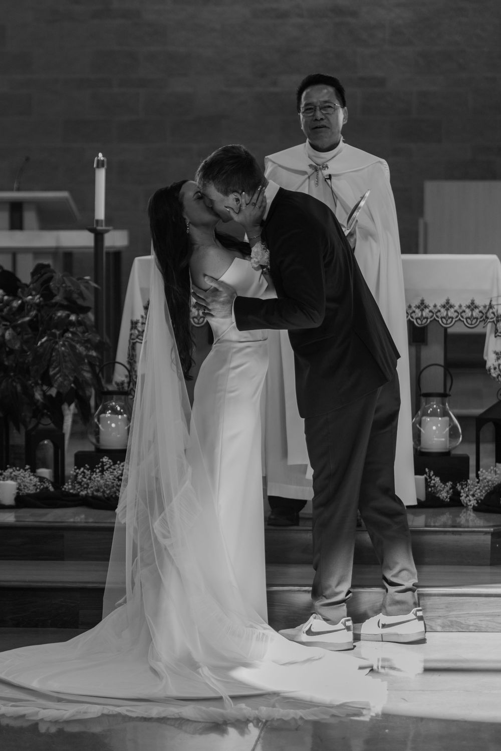 A series of black and white wedding photos showing the train of a bride's dress trailing on the floor.